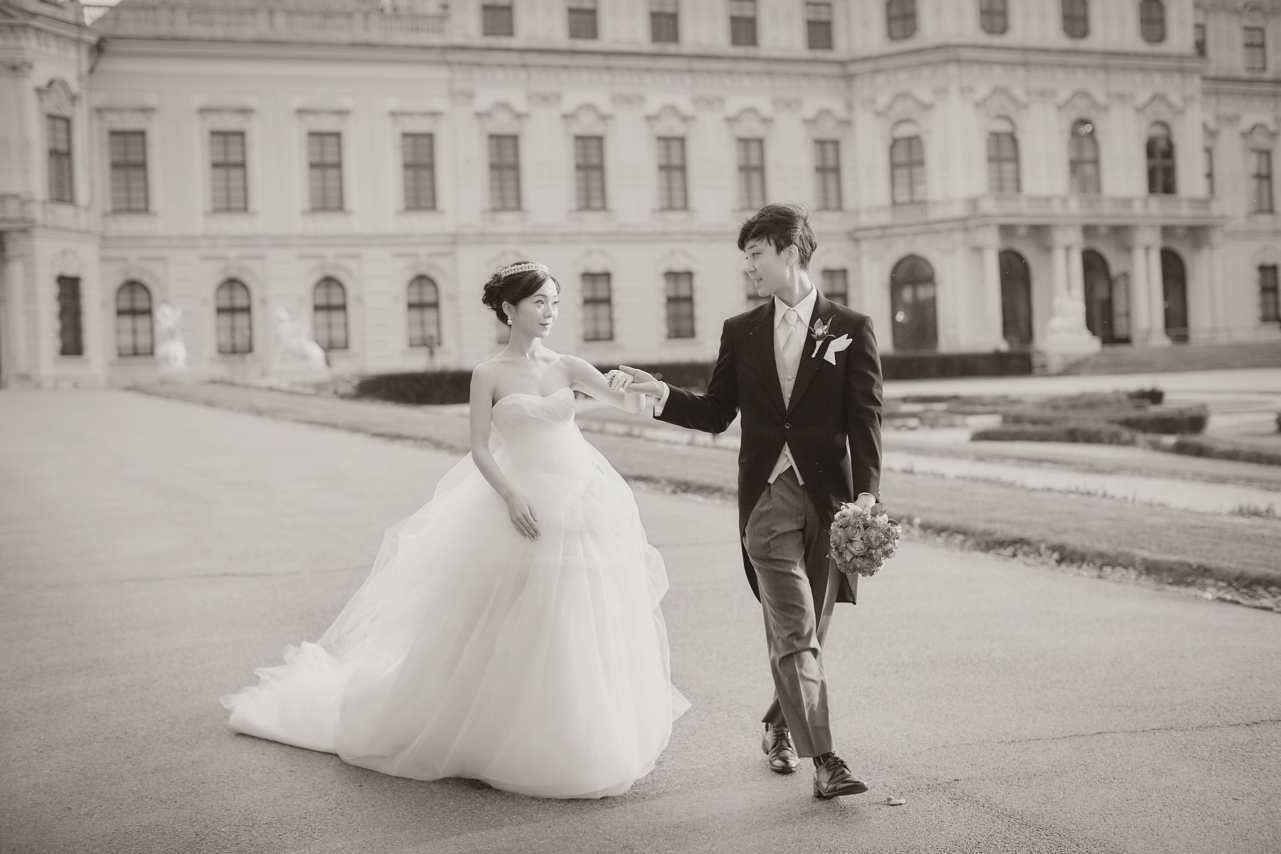 The newlyweds take a small tour of the palace grounds.