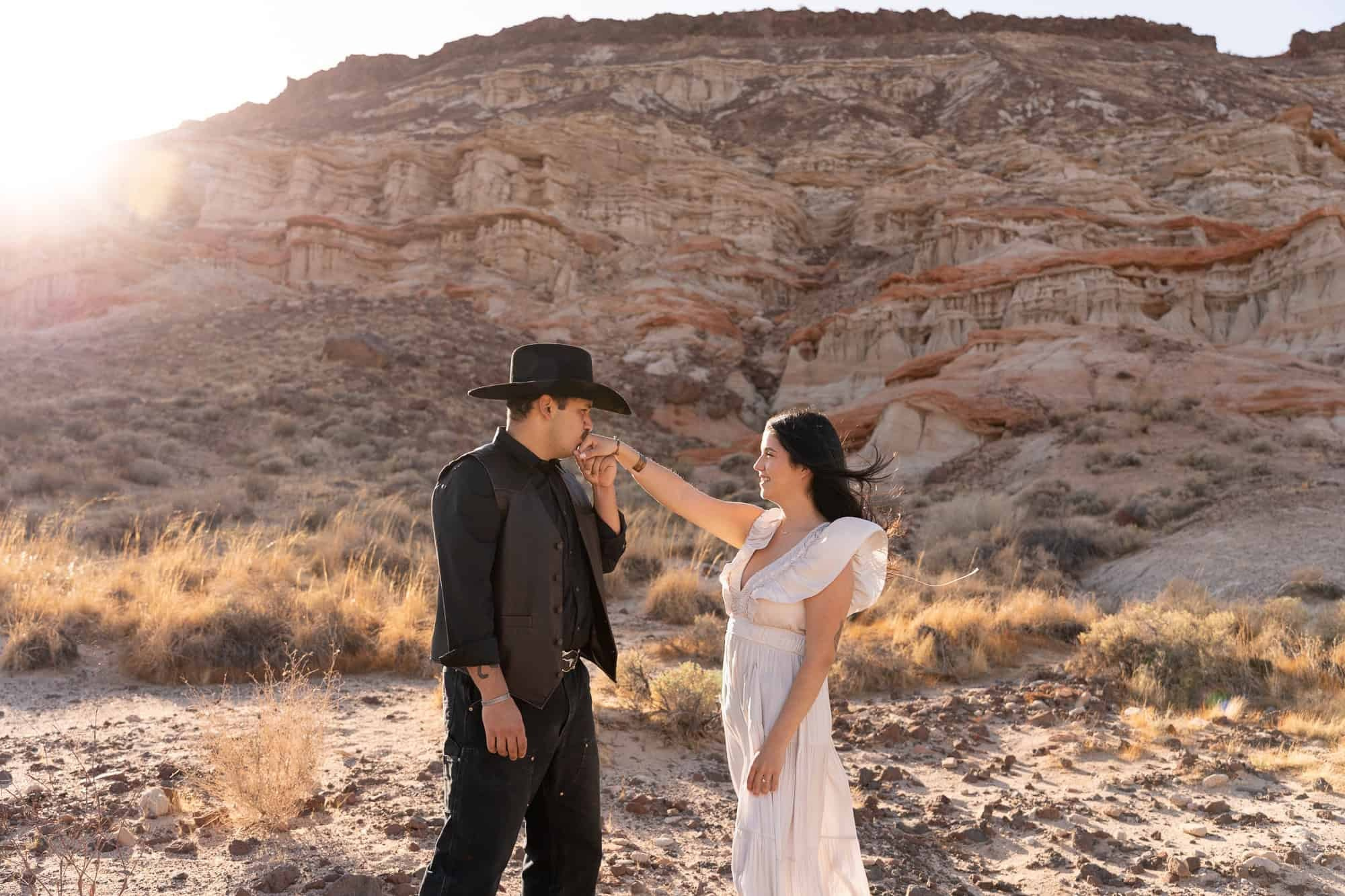 Cowboy-themed engagement session in a sunny desert of California