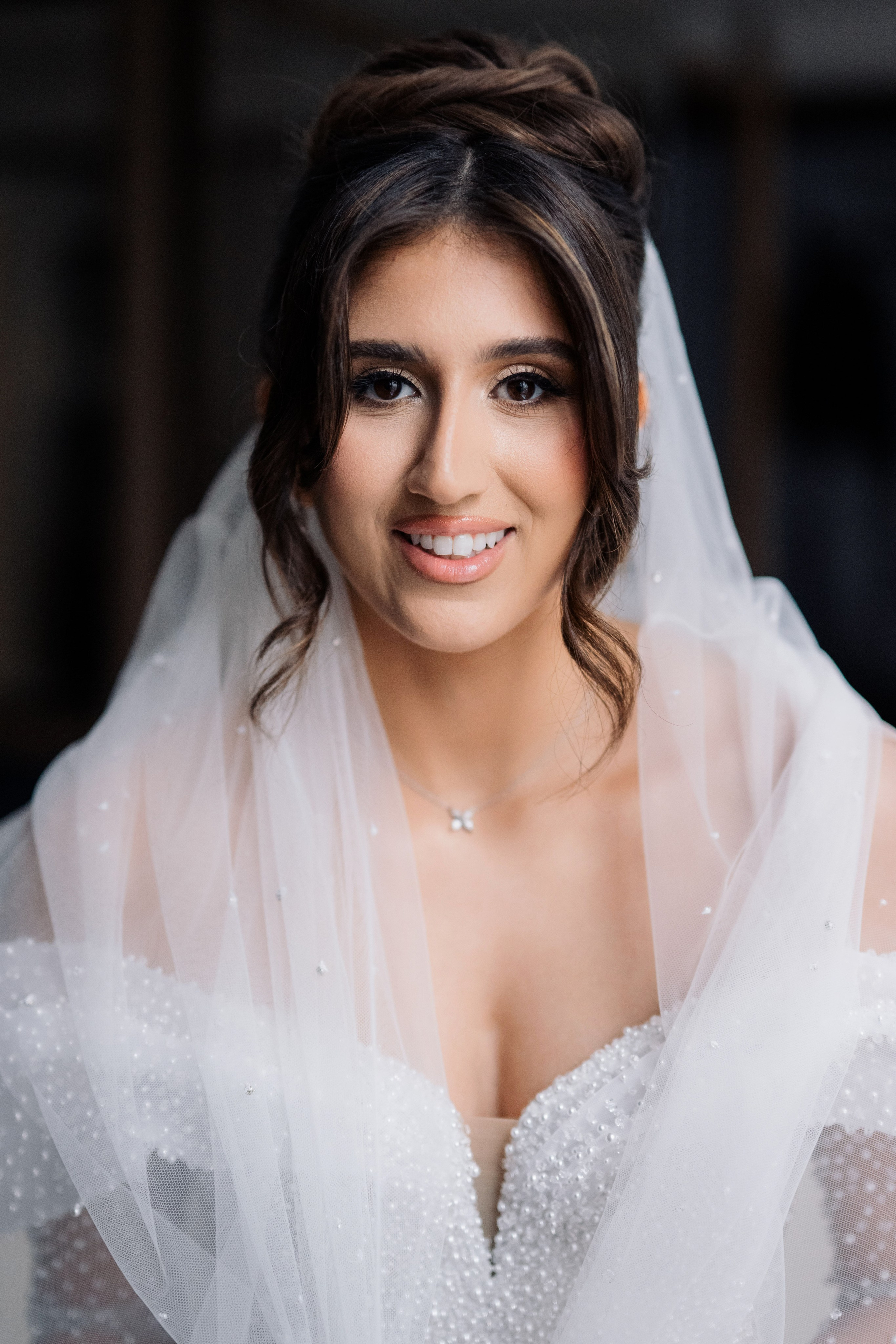 a bride in a white veil and veillet