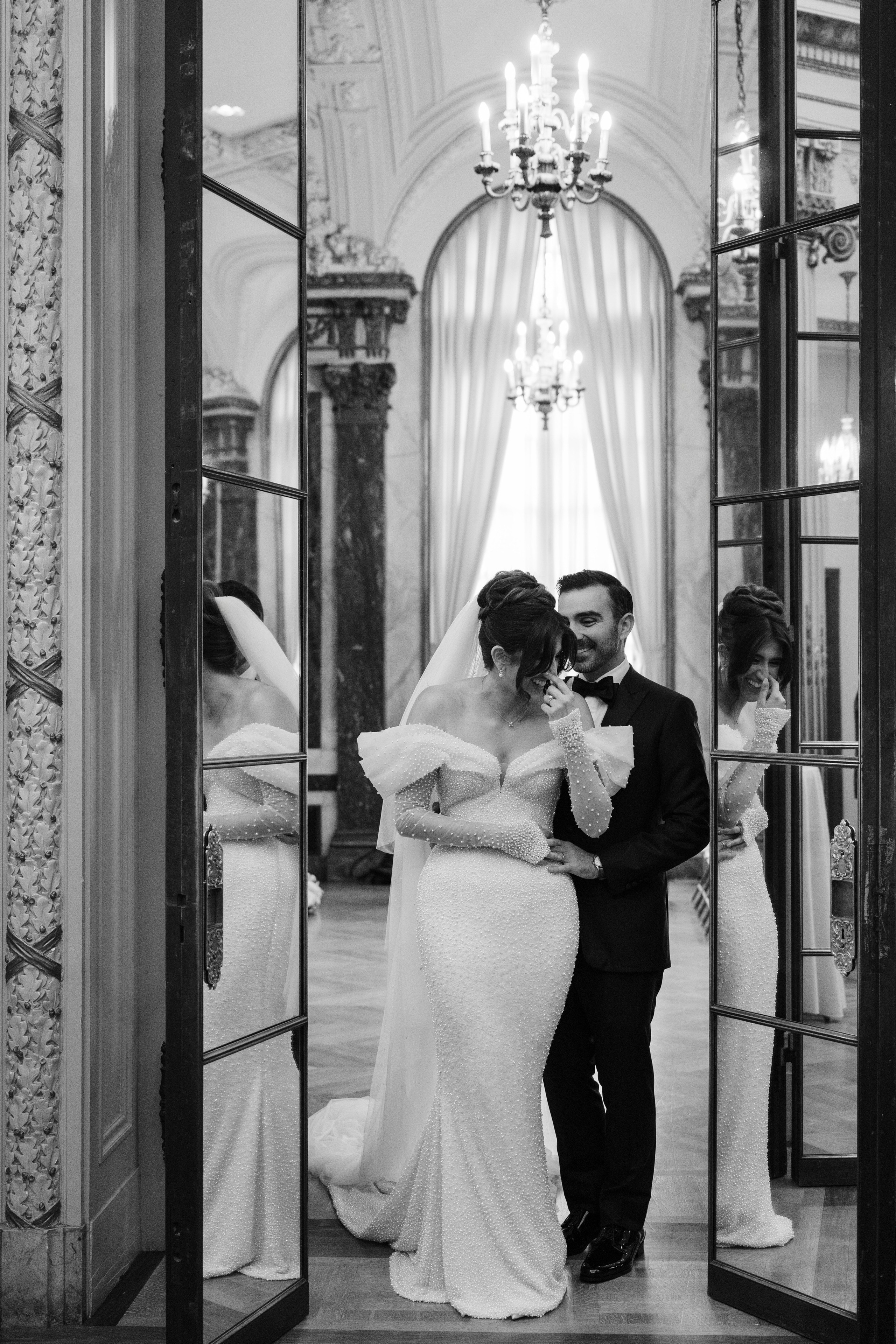 a bride and groom kissing in the doorway of a church