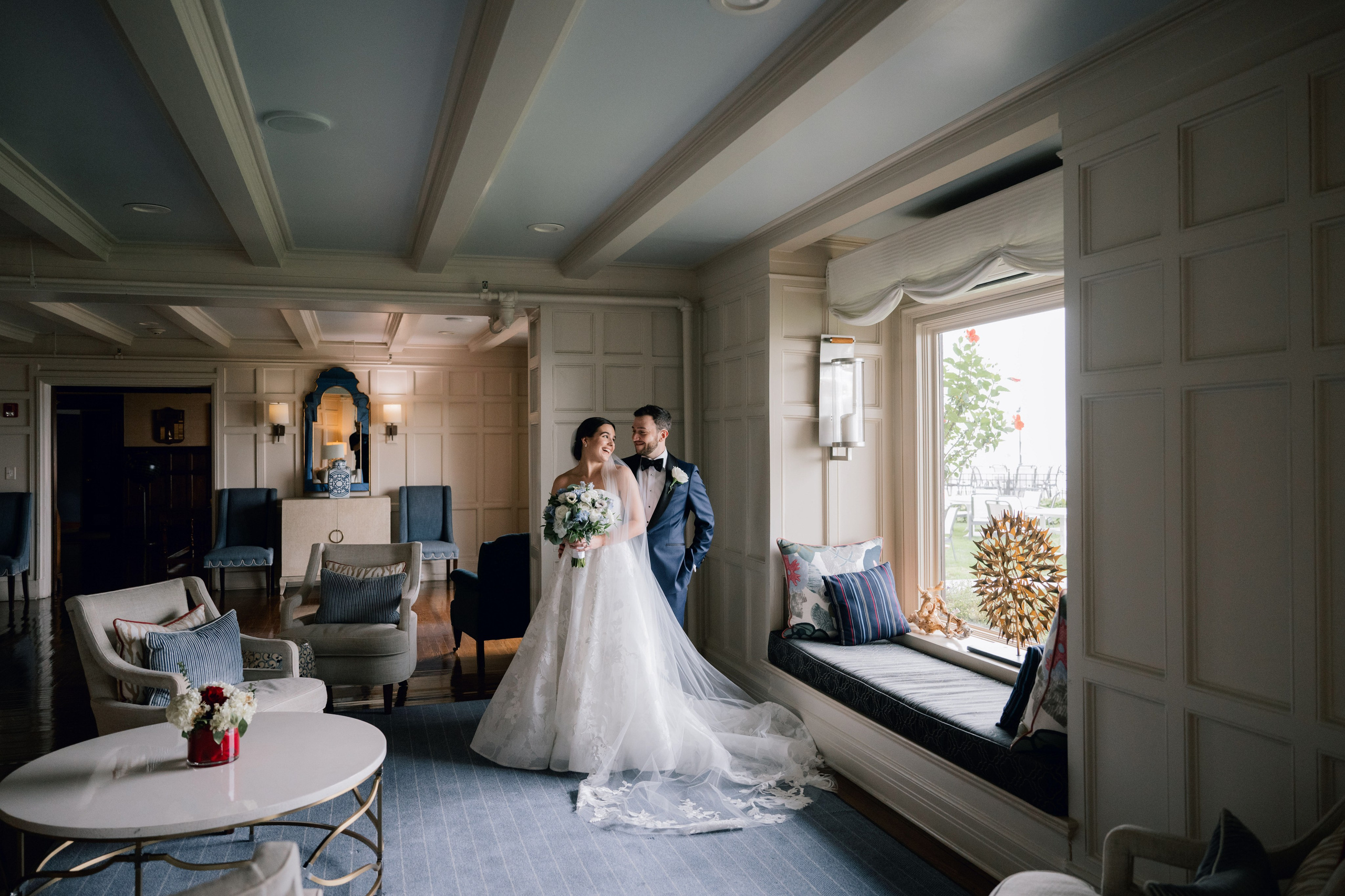 a bride and groom standing in a room