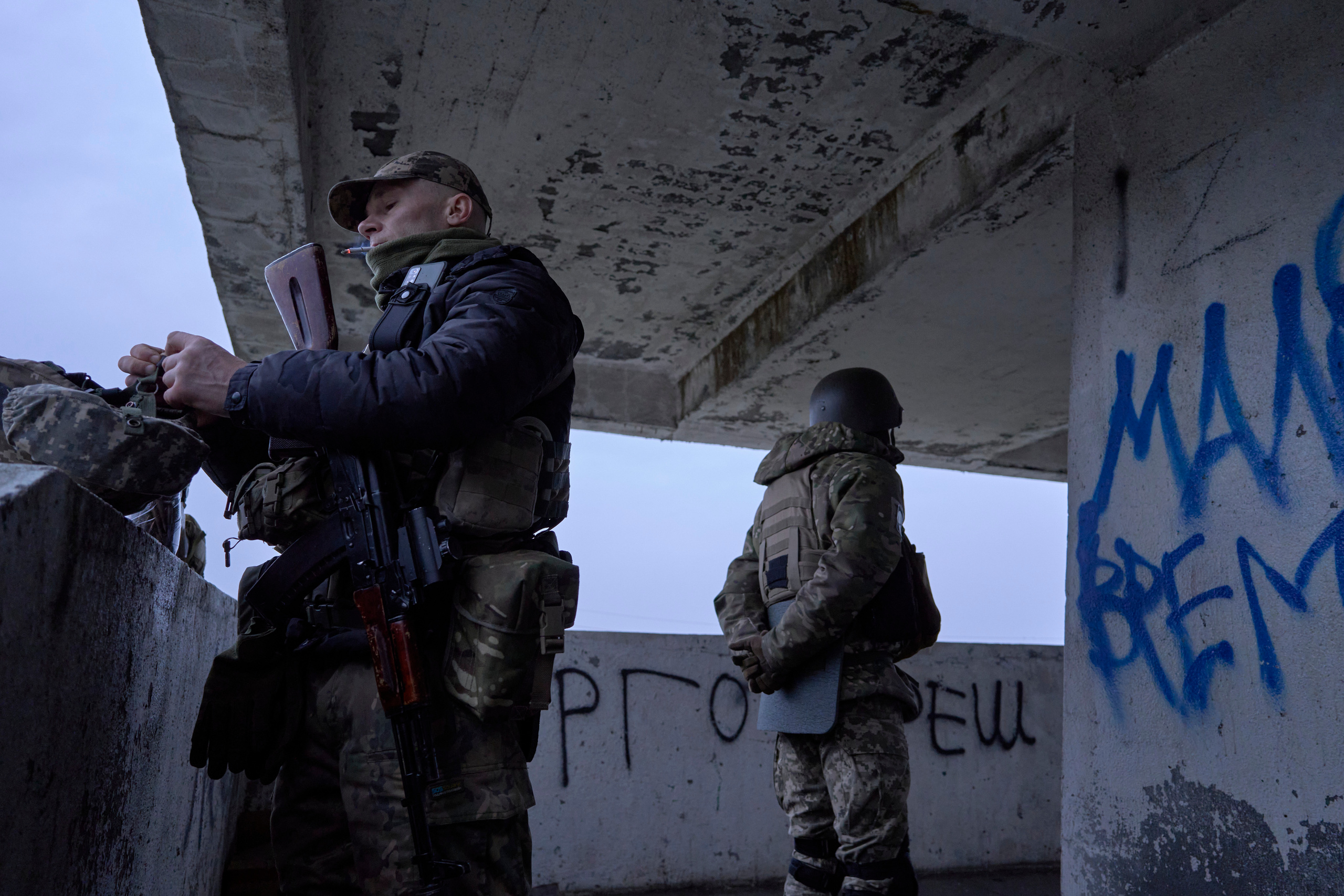 hor (L) and Dima (R) on their duty at Antonivskyi bridge. Antonivka, Kherson region.