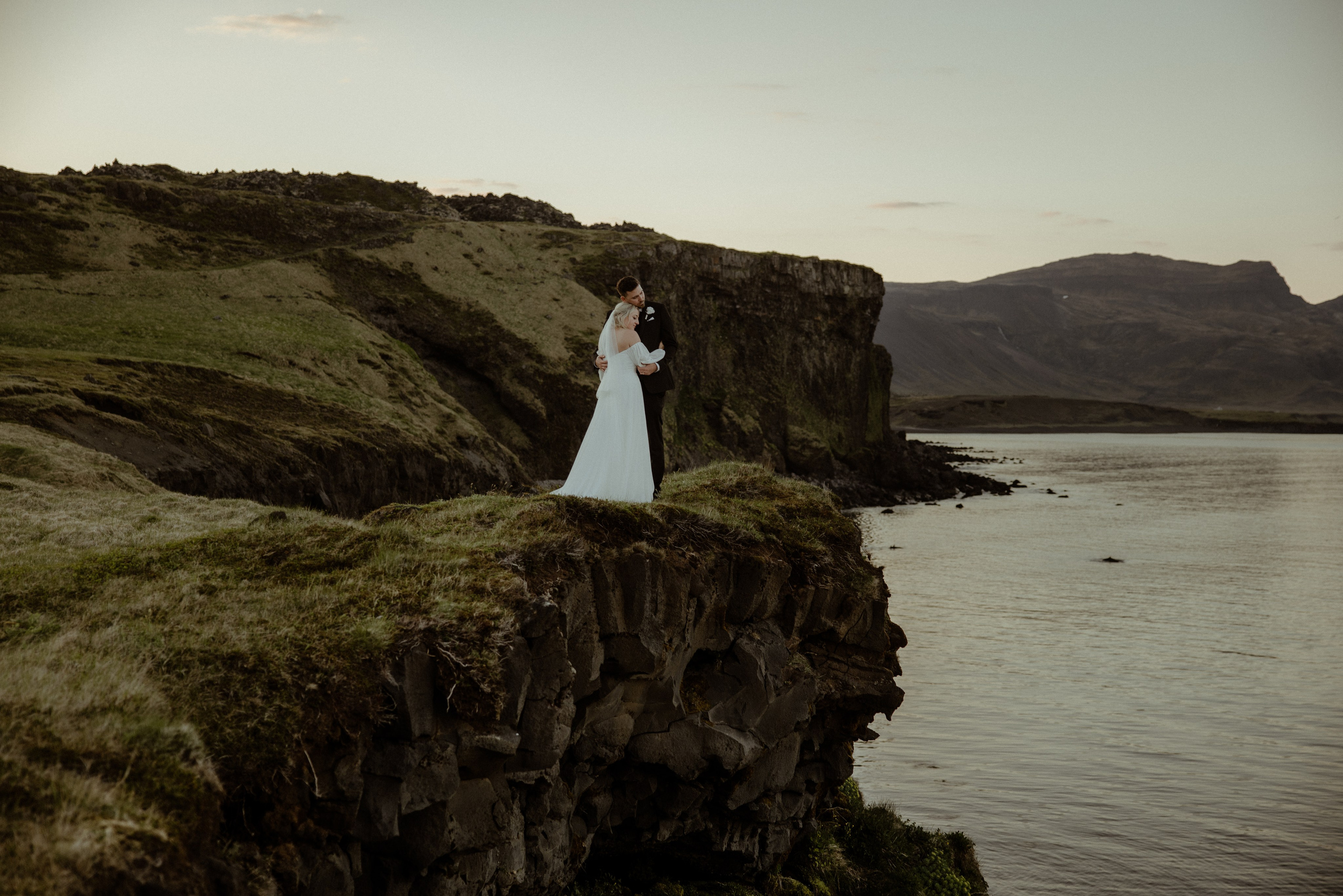 Iceland elopement at Budir with midnight sun wedding photos at black sand beach. Iceland elopement photographer & videographer