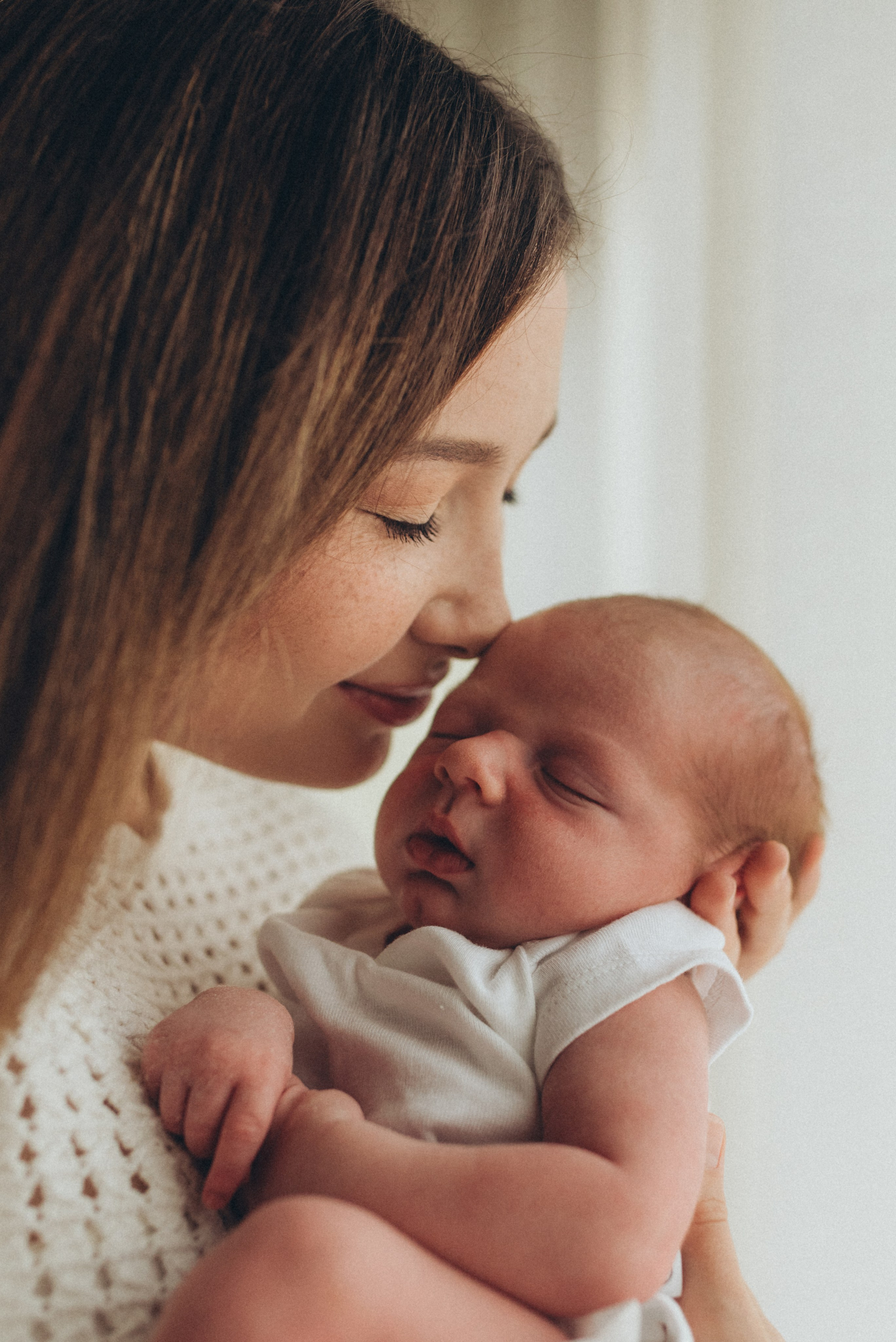 mom holding a newborn baby