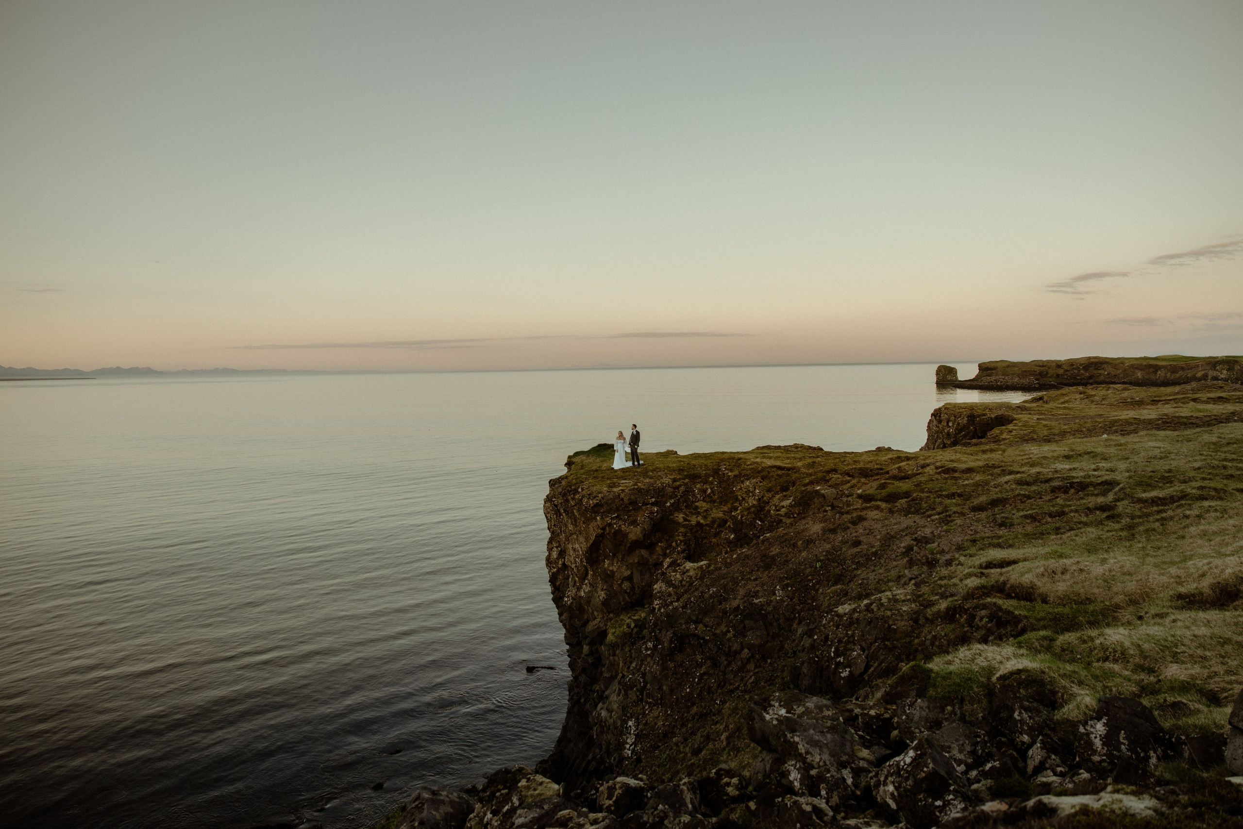Iceland elopement at Budir with midnight sun wedding photos at black sand beach. Iceland elopement photographer & videographer