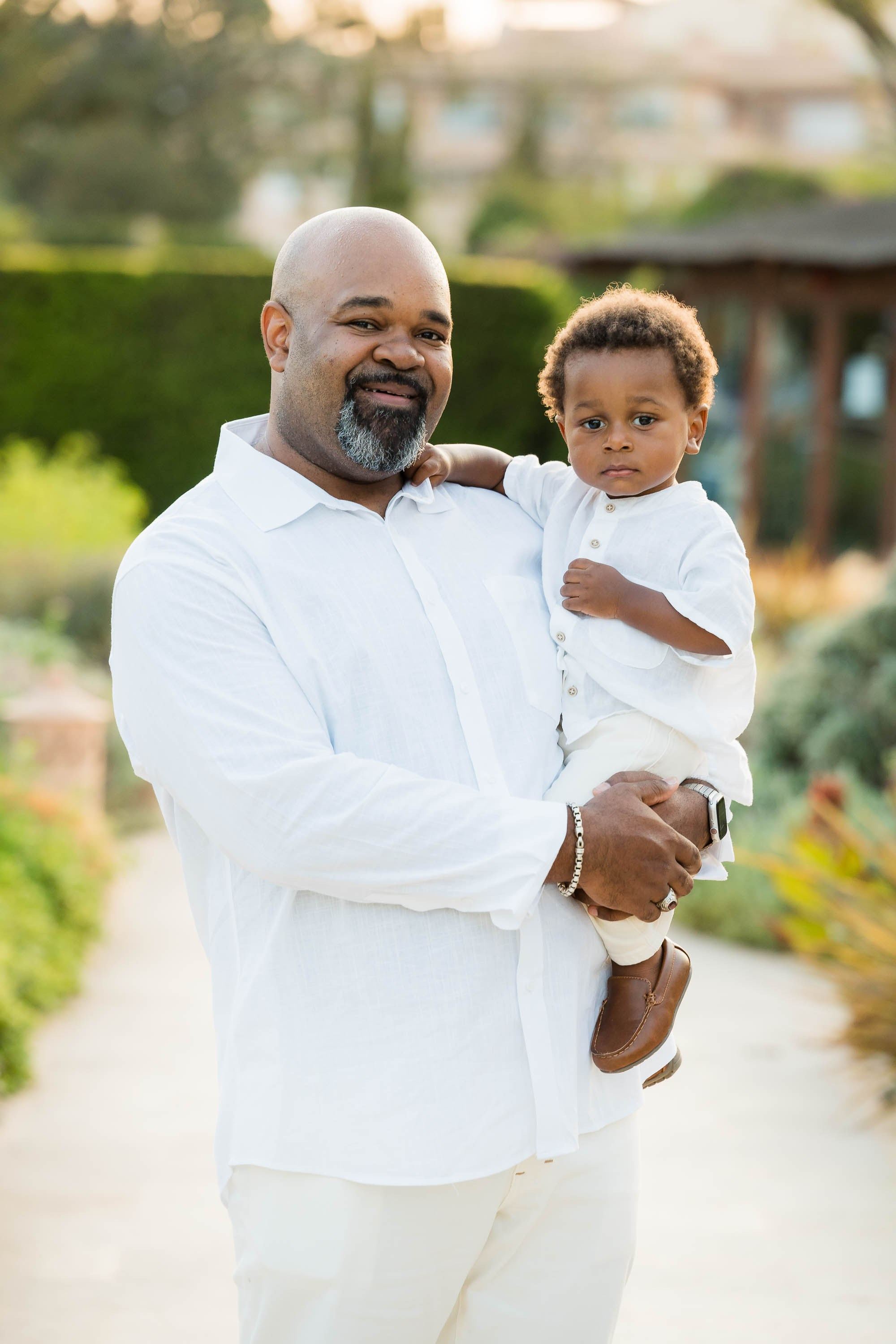 Father and son having Family Portraits at St. Regis Mardavall in Mallorca
