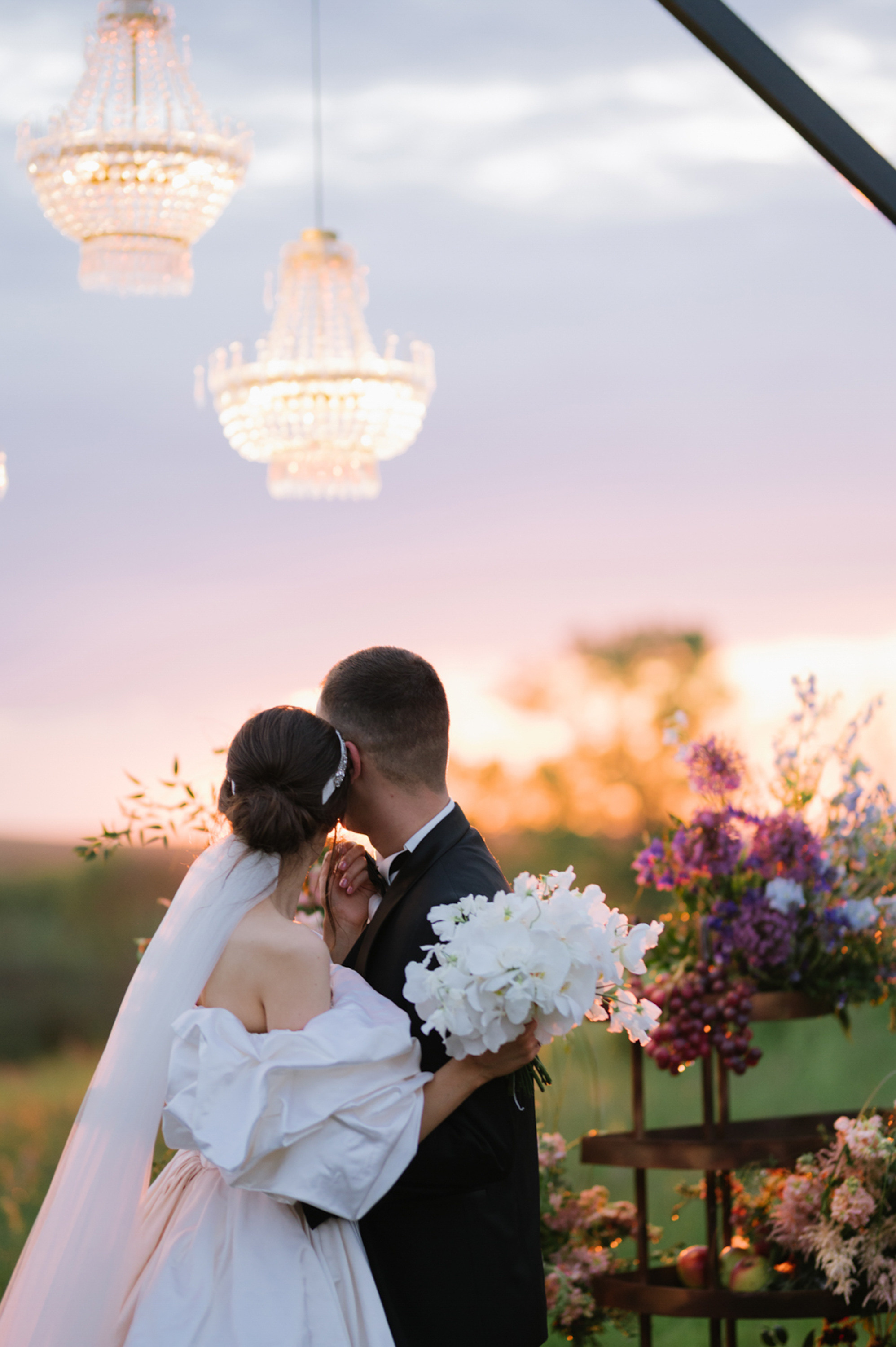 a bride and groom kissing