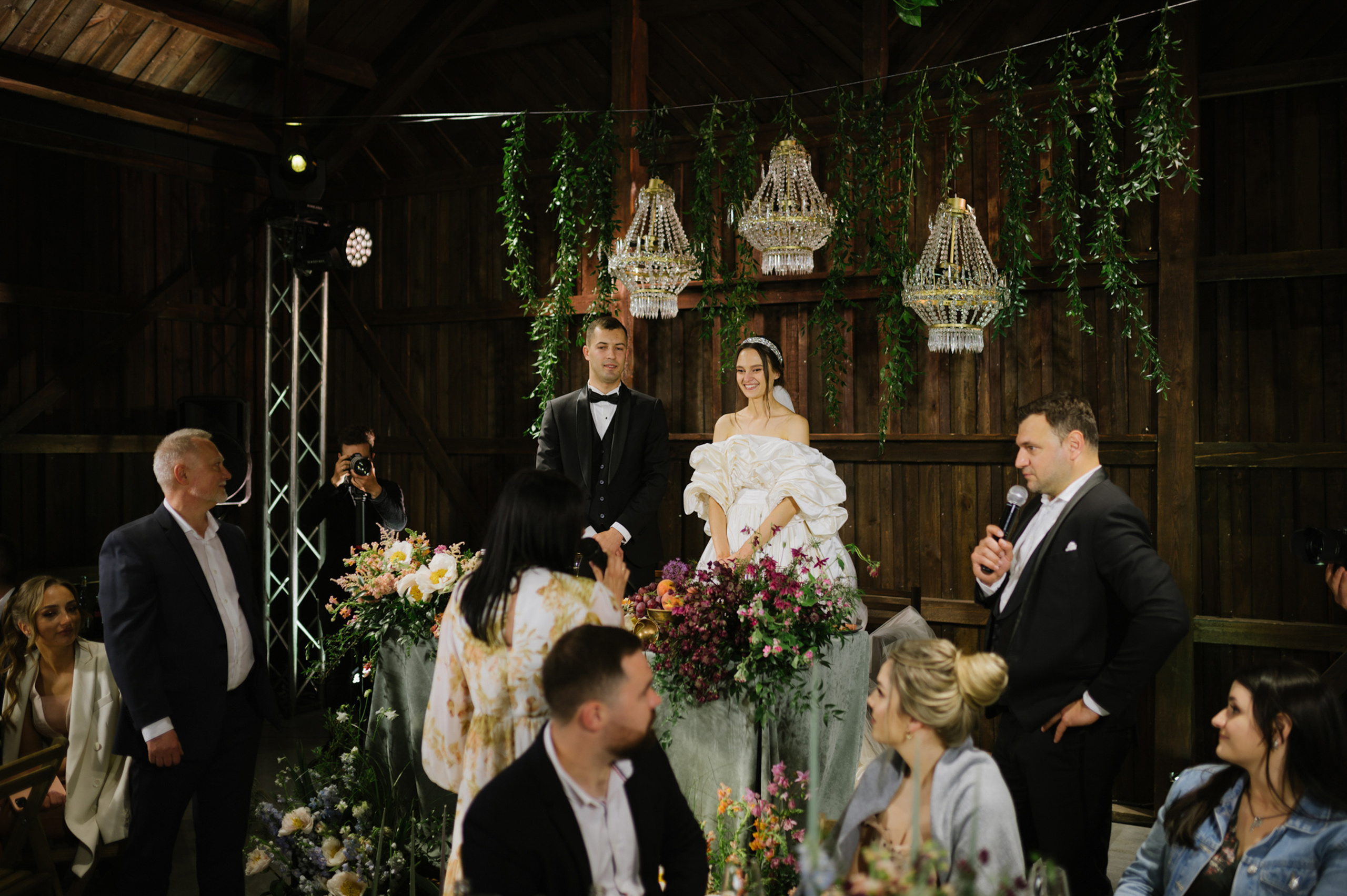 a bride and groom are sitting at a table