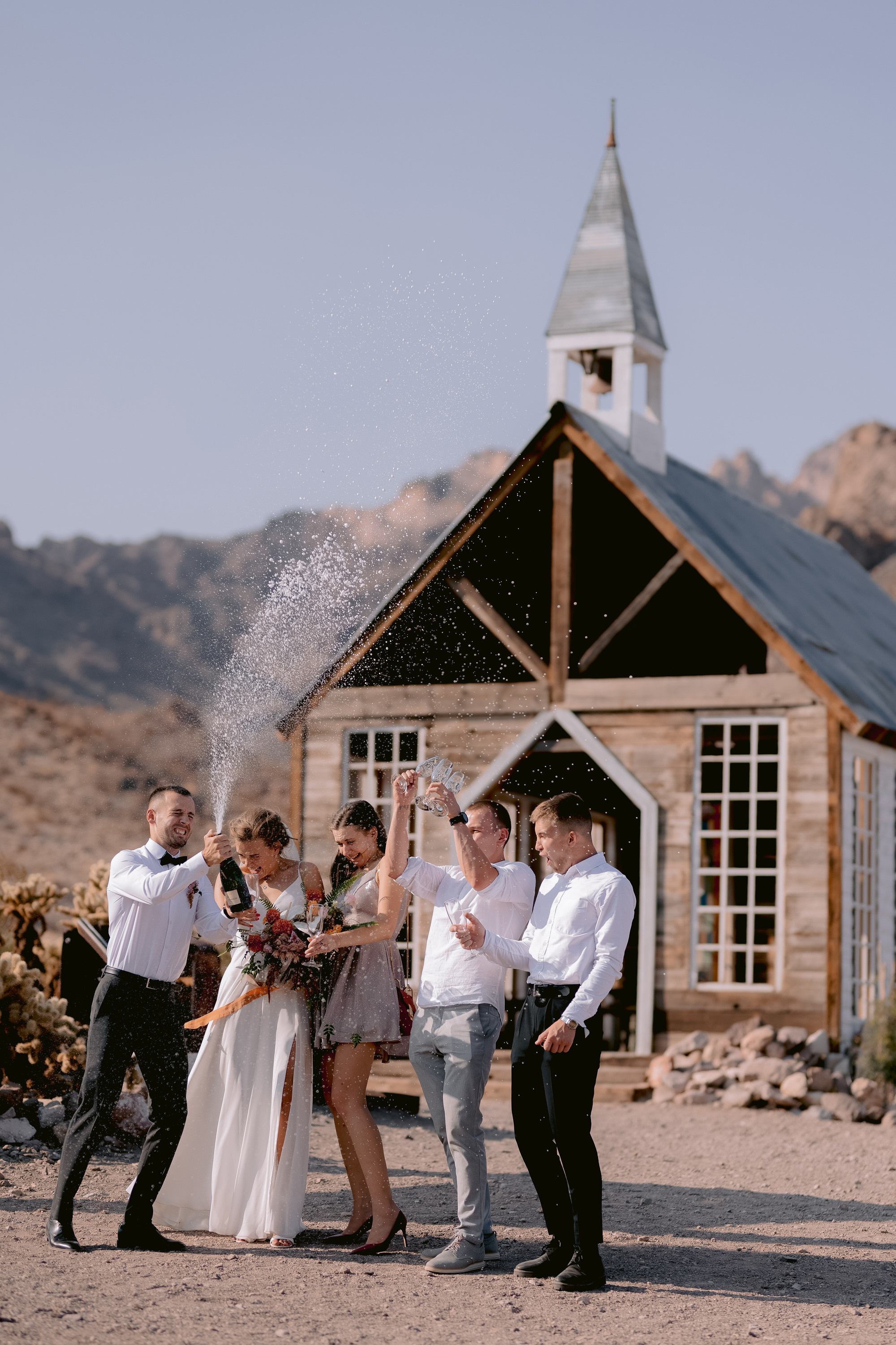 a group of people standing around a church