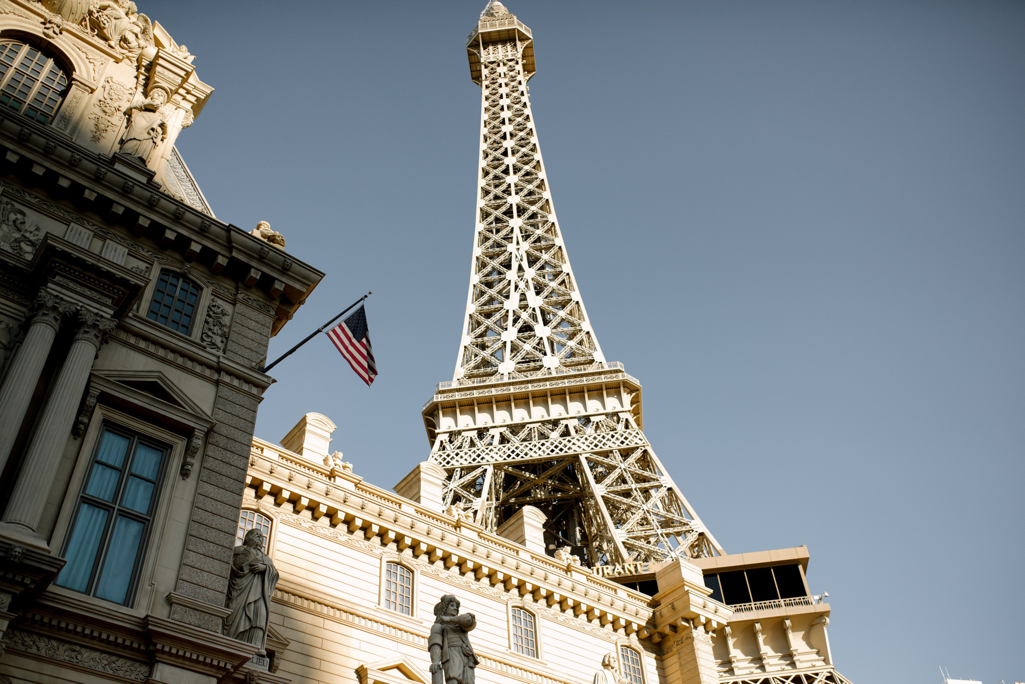 a tall tower with a flag on top