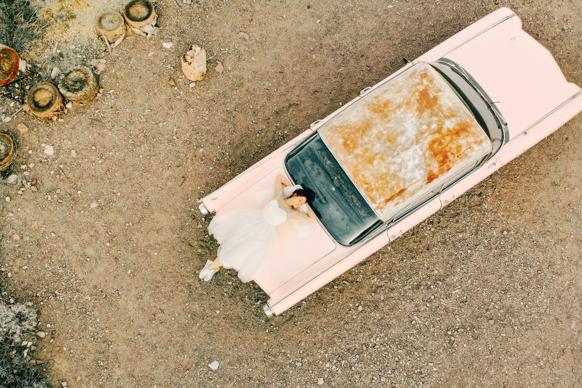 a broken pink car on the ground