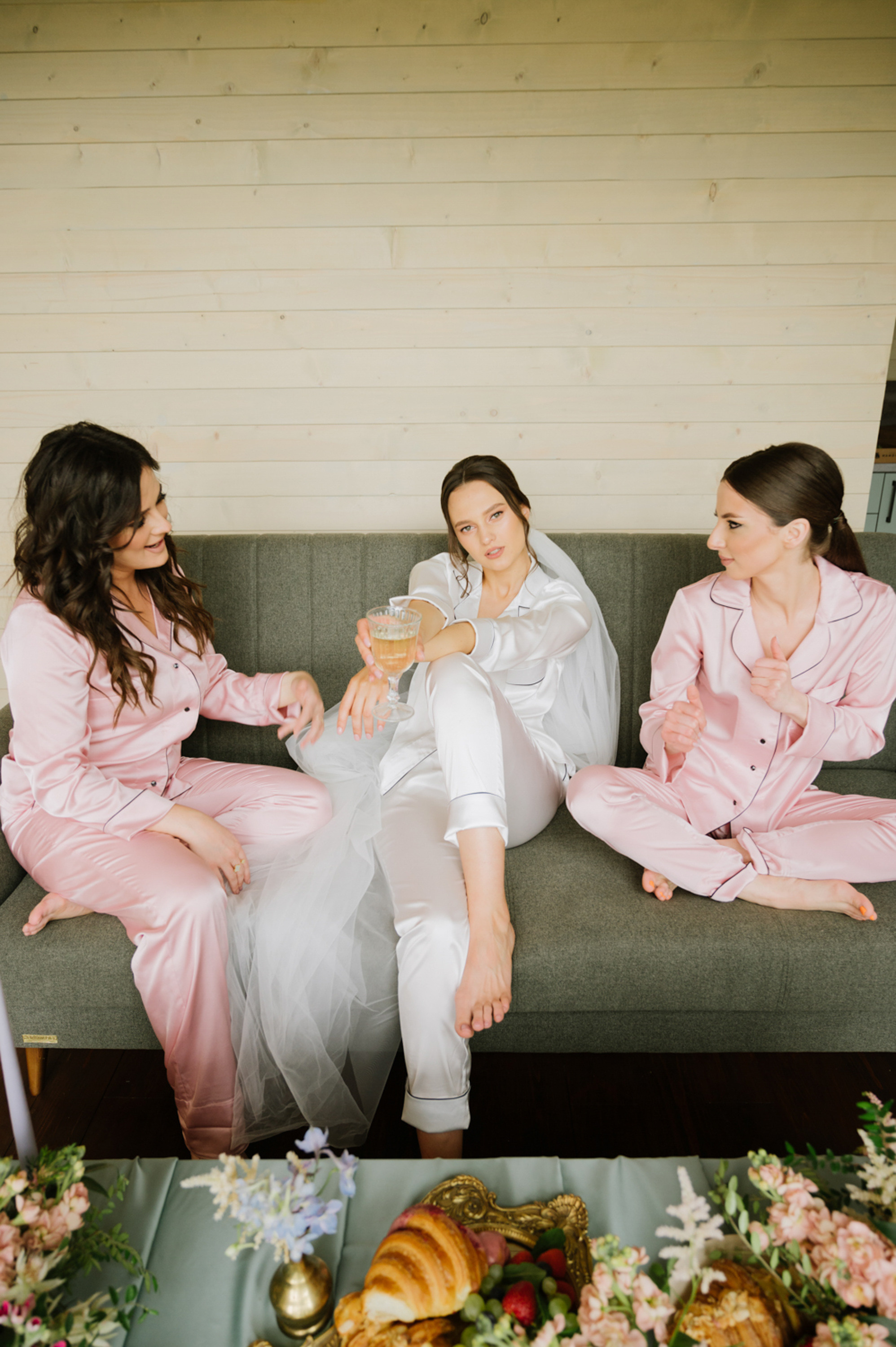 two women sitting on a couch