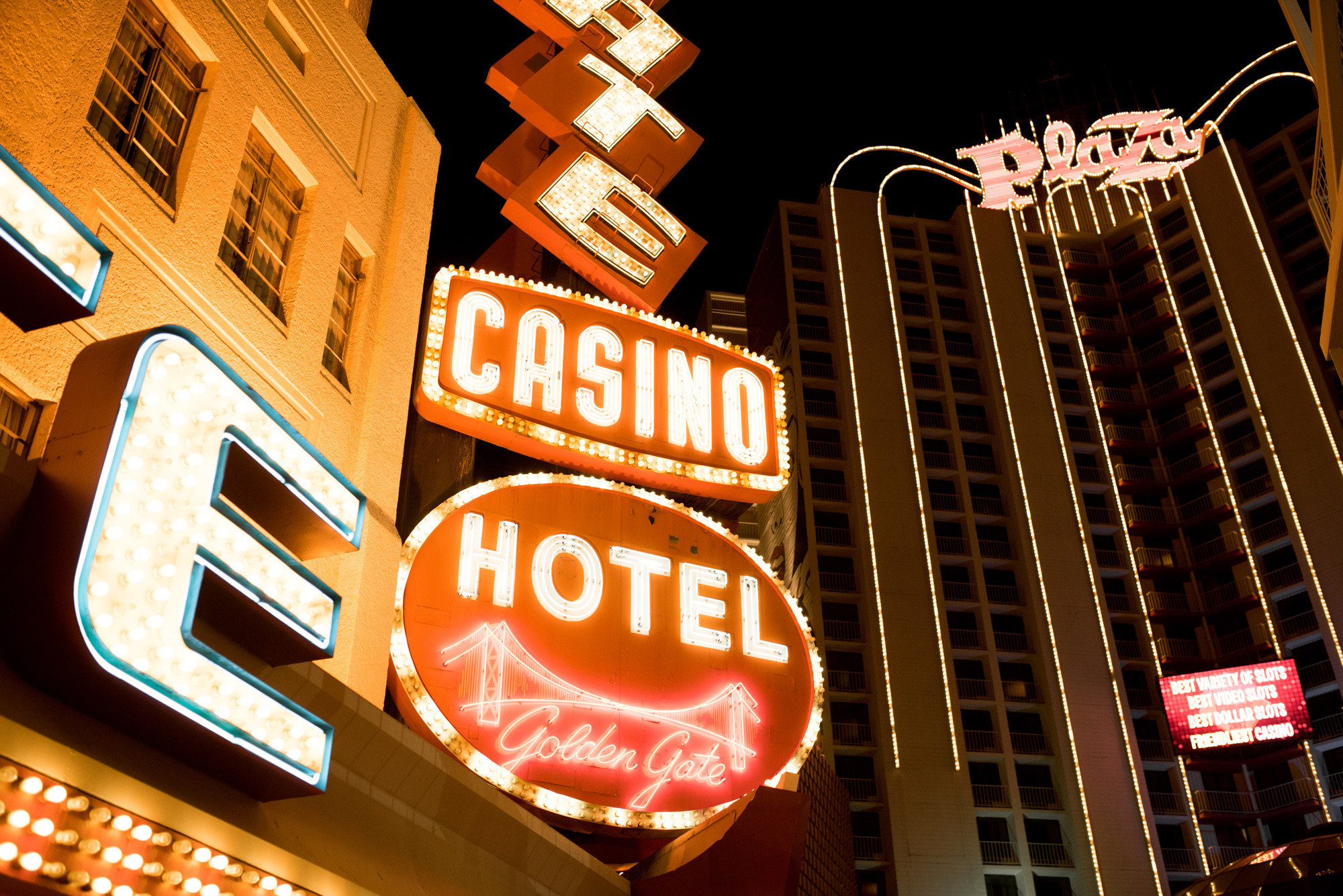 a neon sign is lit up in the night