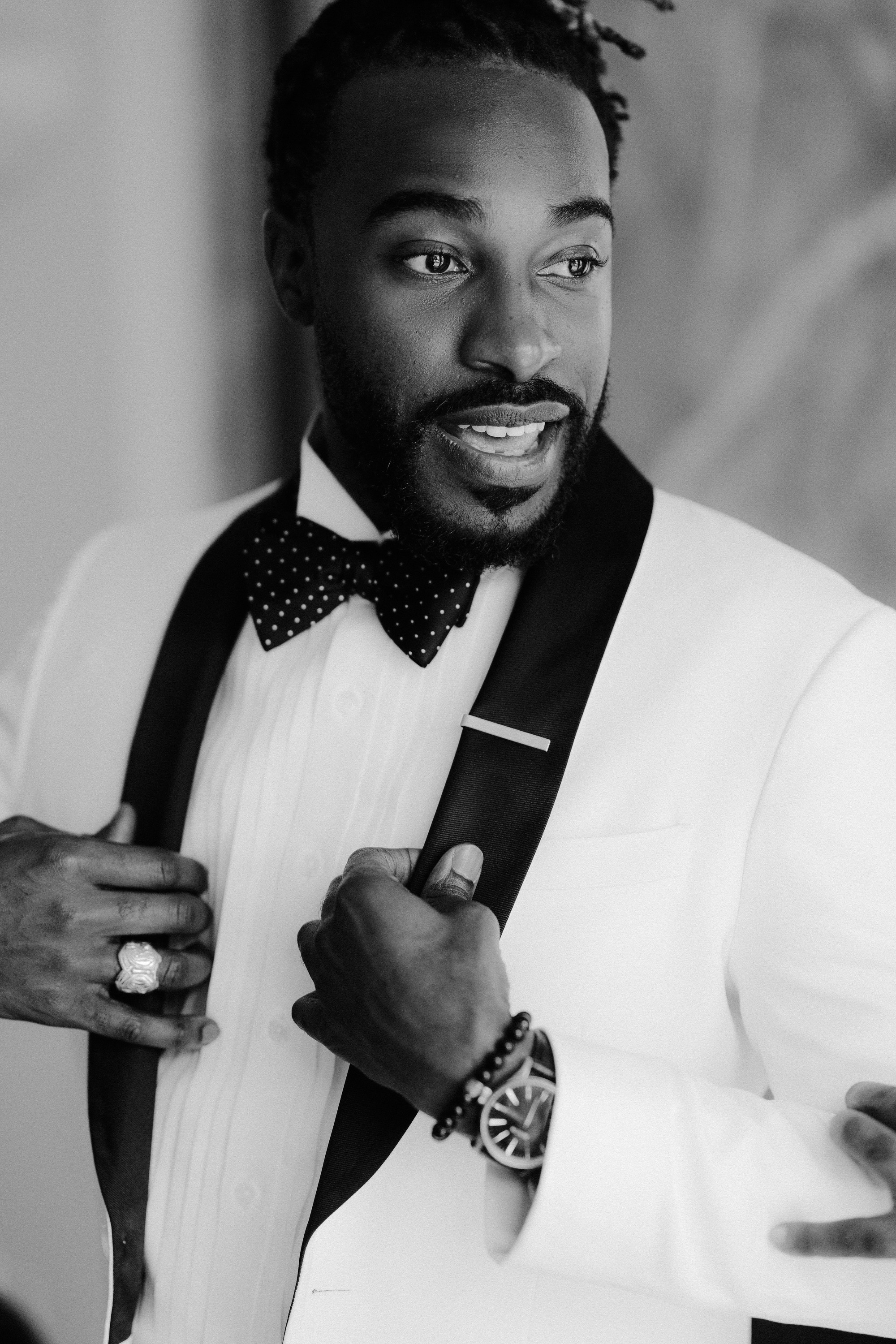 a man in a tuxed suit and bow tie