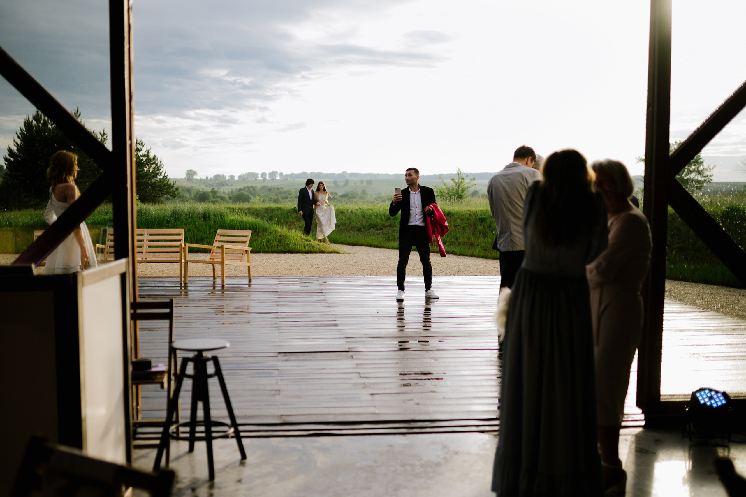 a group of people standing around a wooden structure