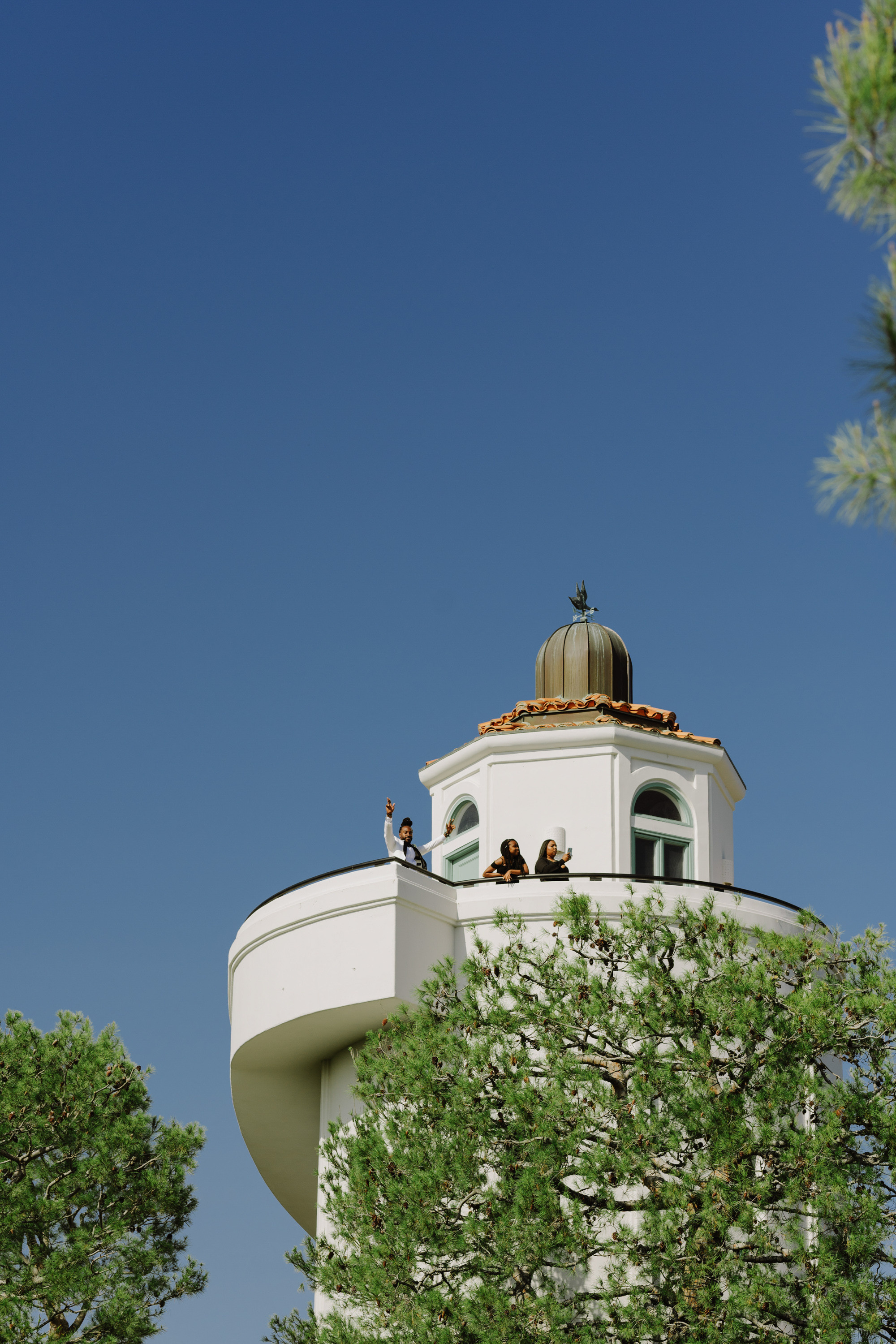 a white tower with a clock on top
