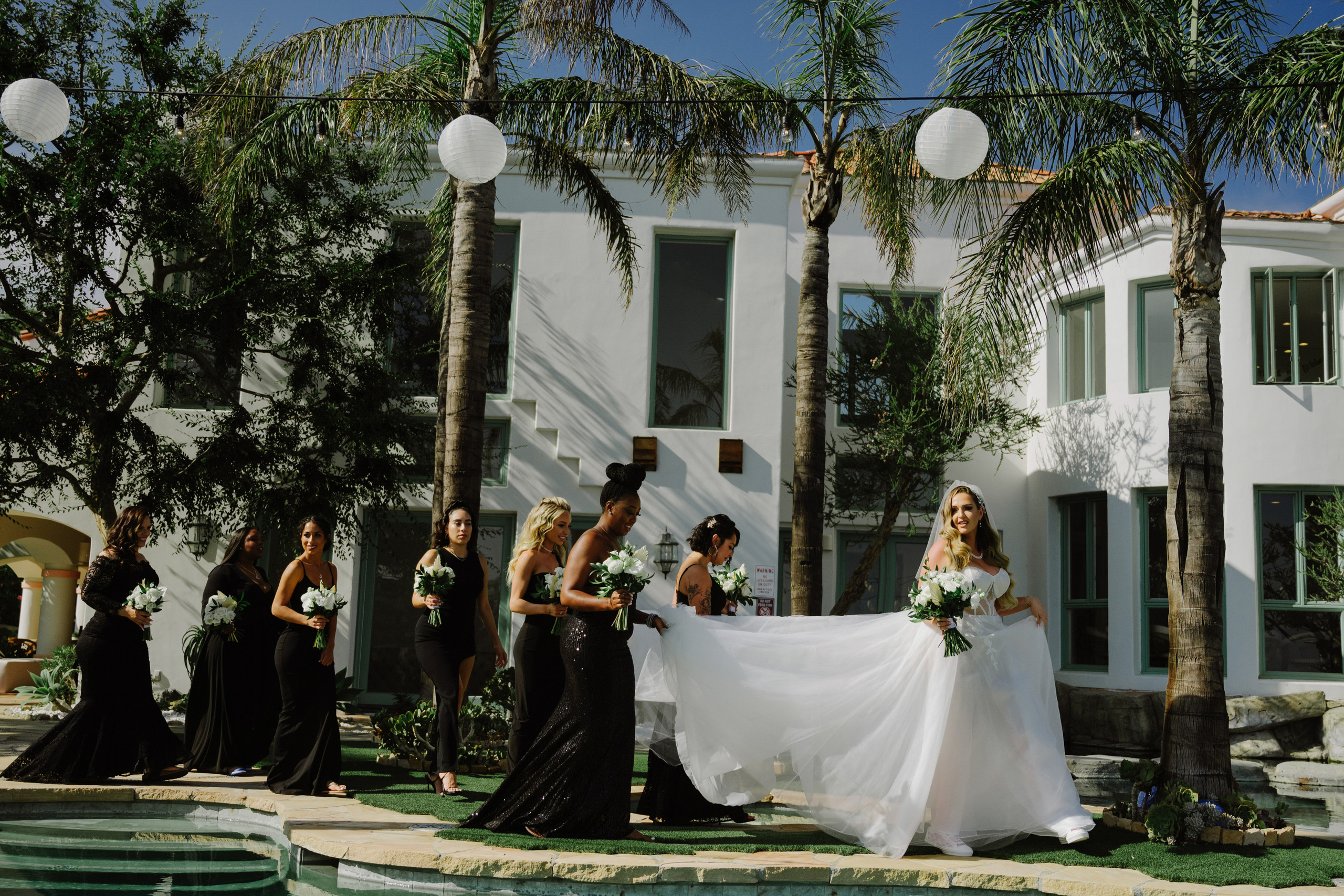 a bride and her bridesmaids are getting ready to walk down the aisle