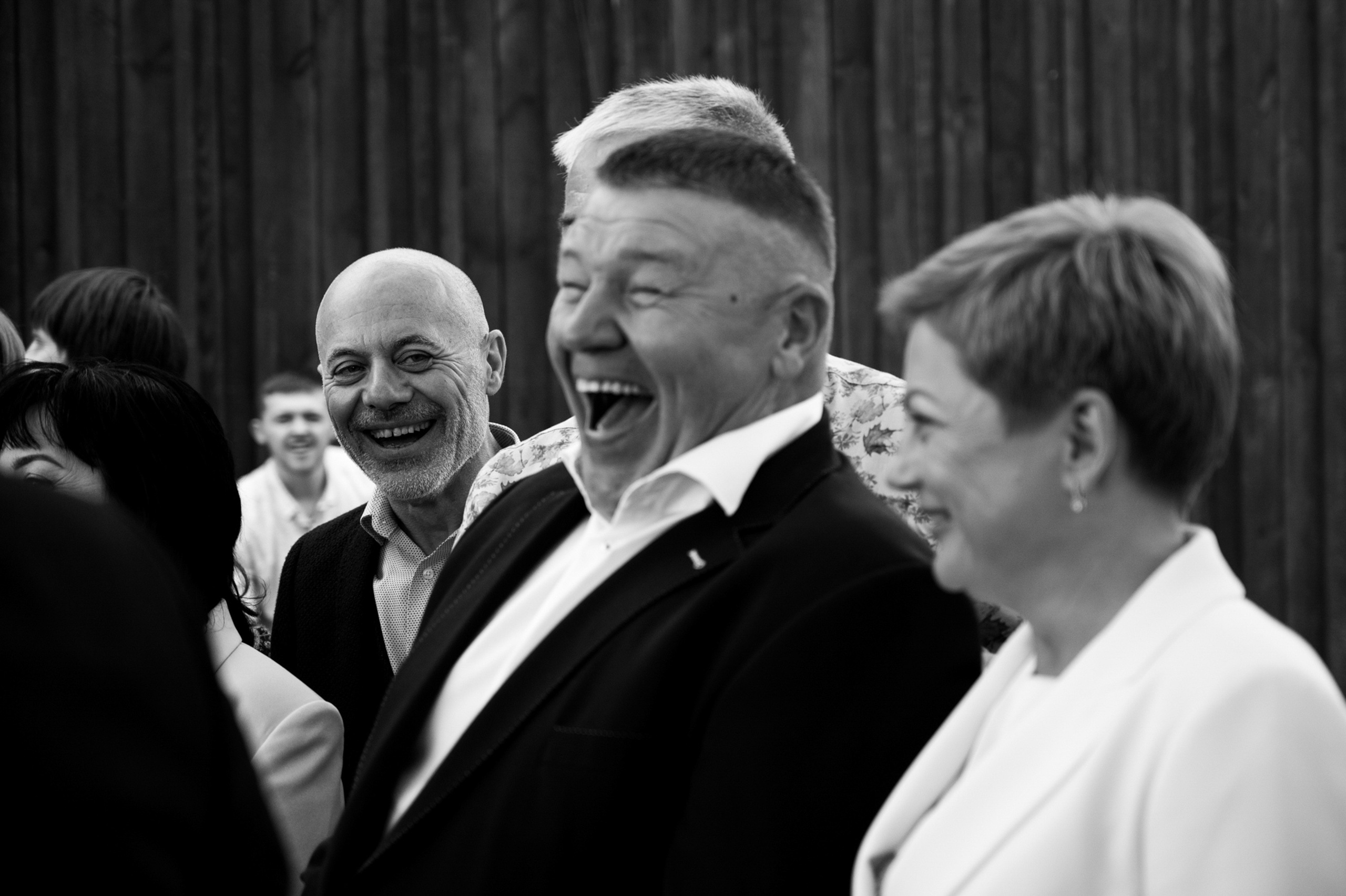 a group of people standing around each other people