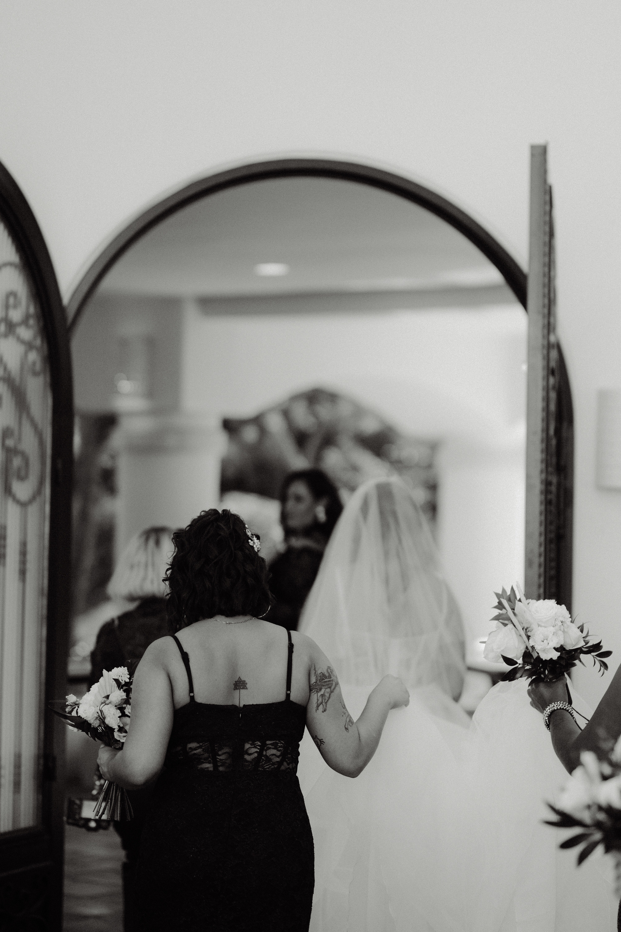 a bride and her mother walking down the aisle