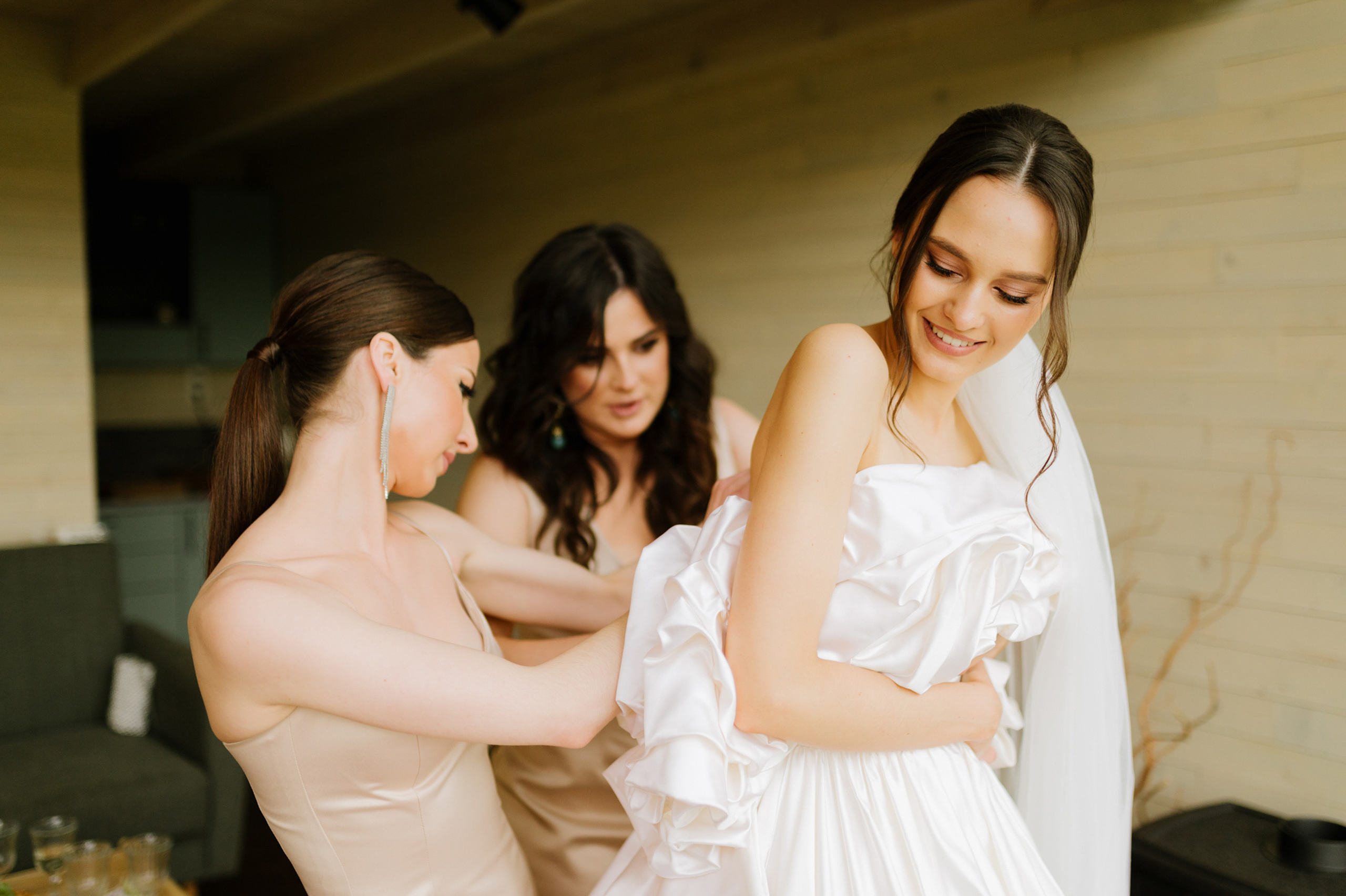 a bride getting ready to get into her wedding dress