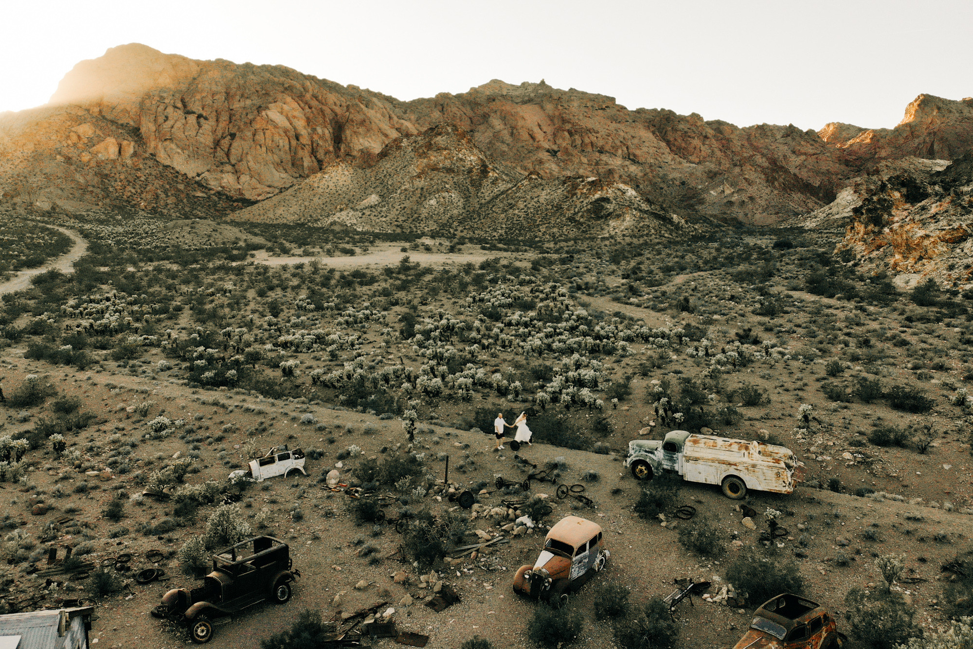 a bunch of junk cars in a desert