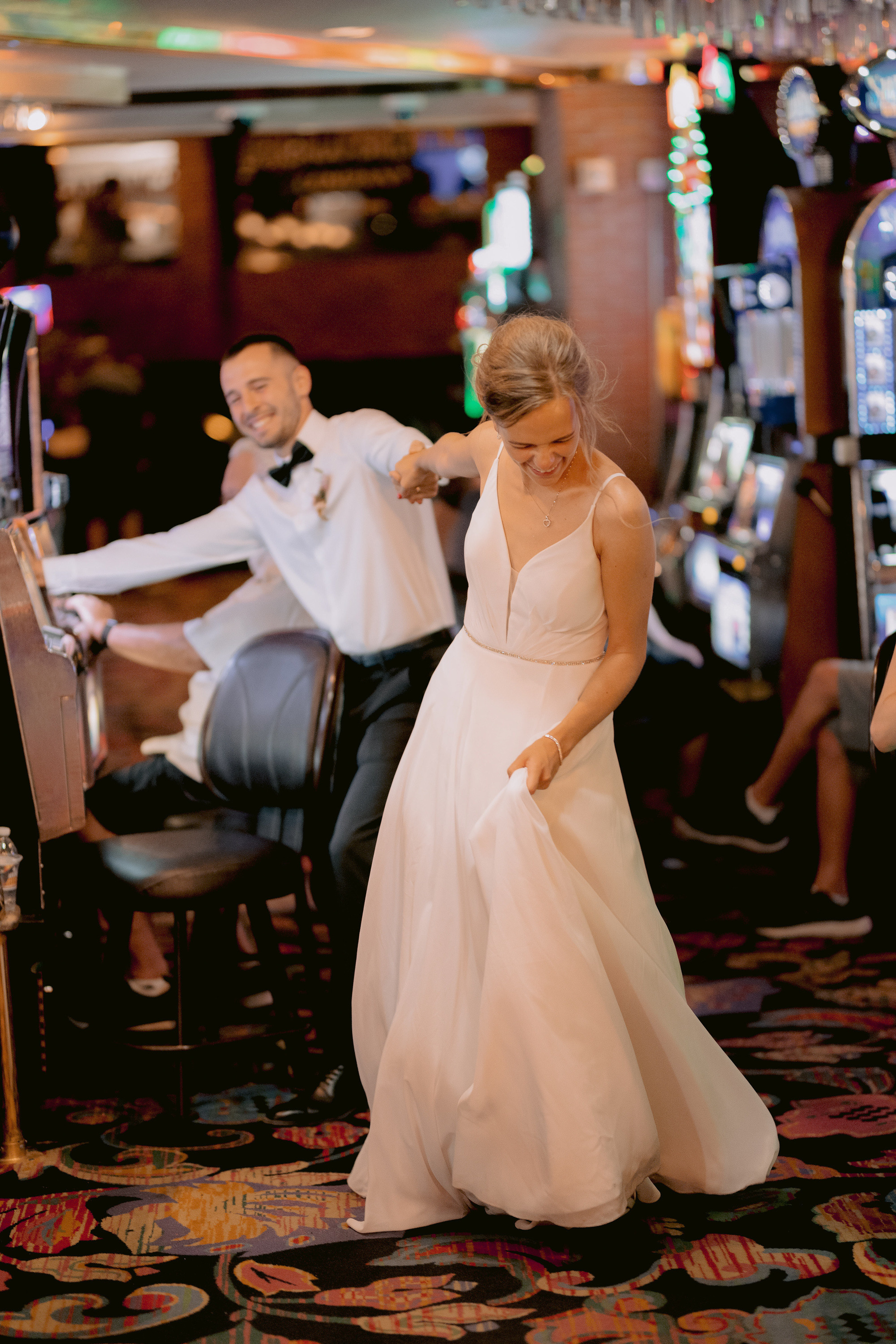 a bride and groom playing a game in a casino