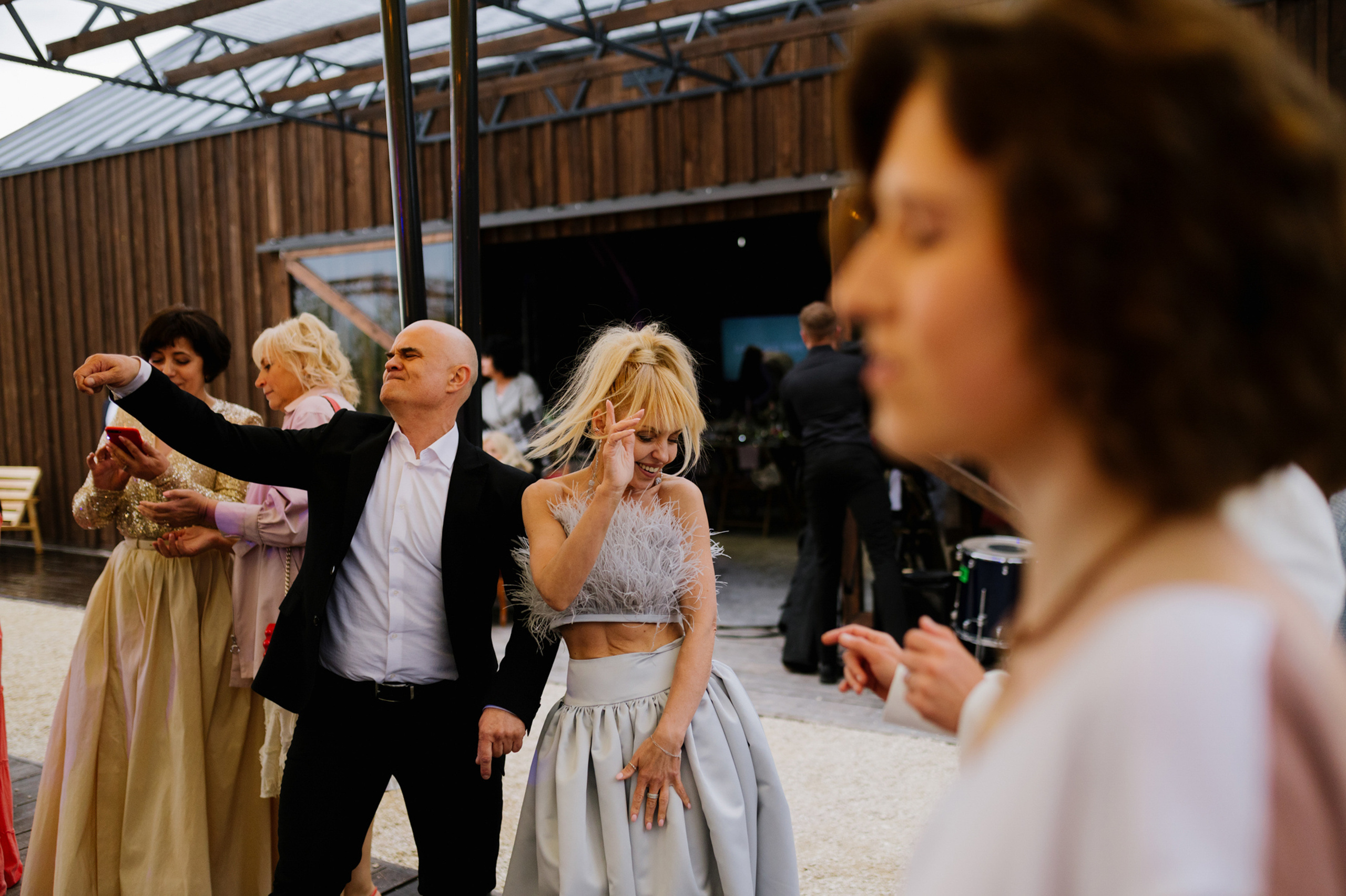 a group of people standing around a woman