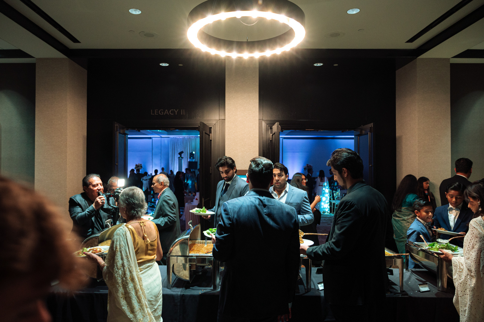a group of people standing around a table