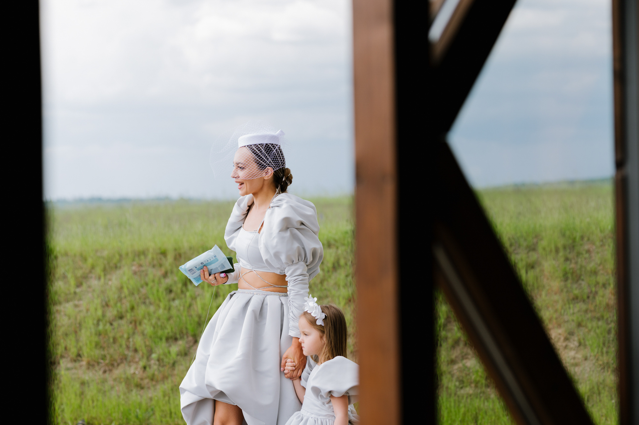 a woman in a white dress and a little girl in a white dress