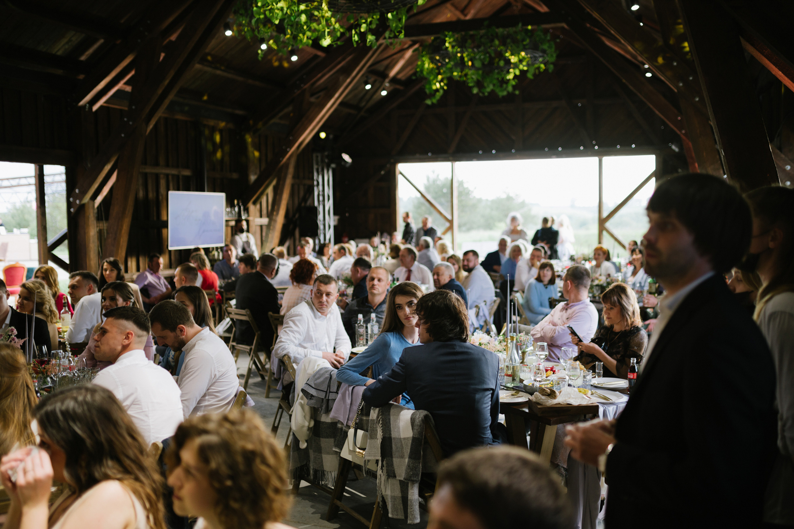 a large group of people sitting at tables