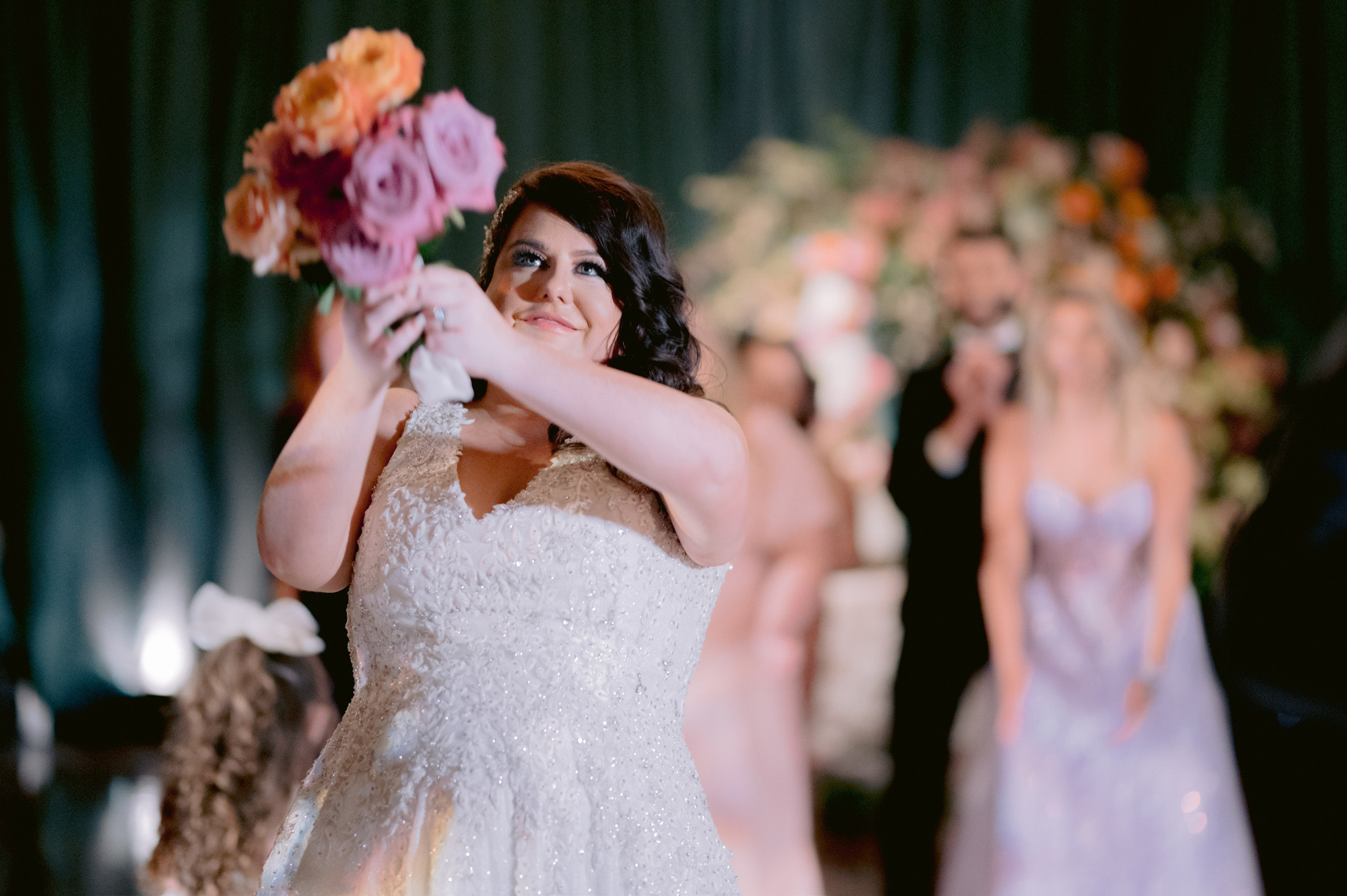 a woman in a wedding dress holding a flower