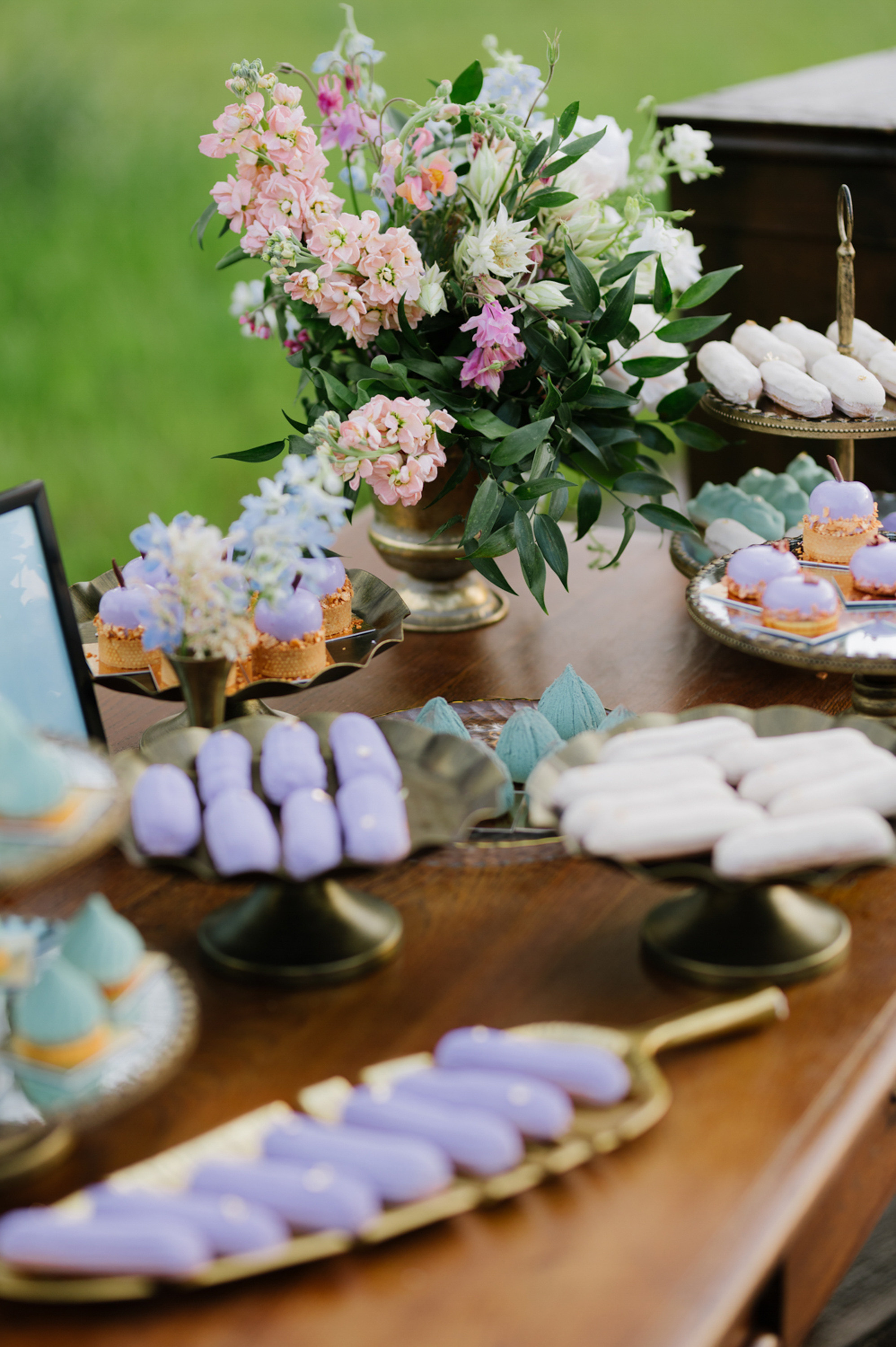 a table with a bunch of flowers and a cake