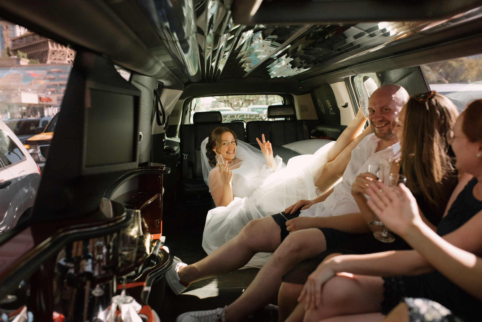 a bride and groom in a limo