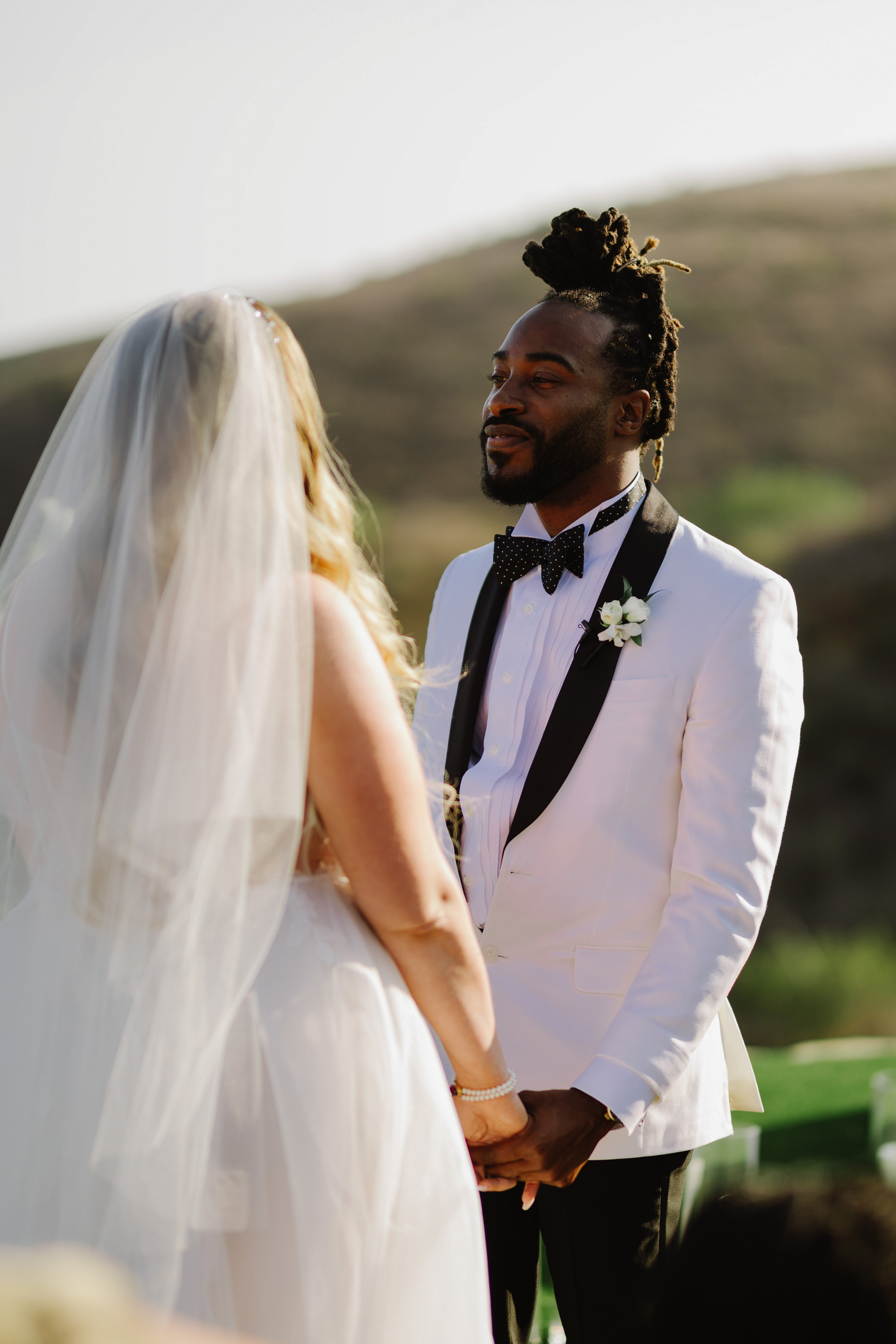 a man and woman standing next to each other people