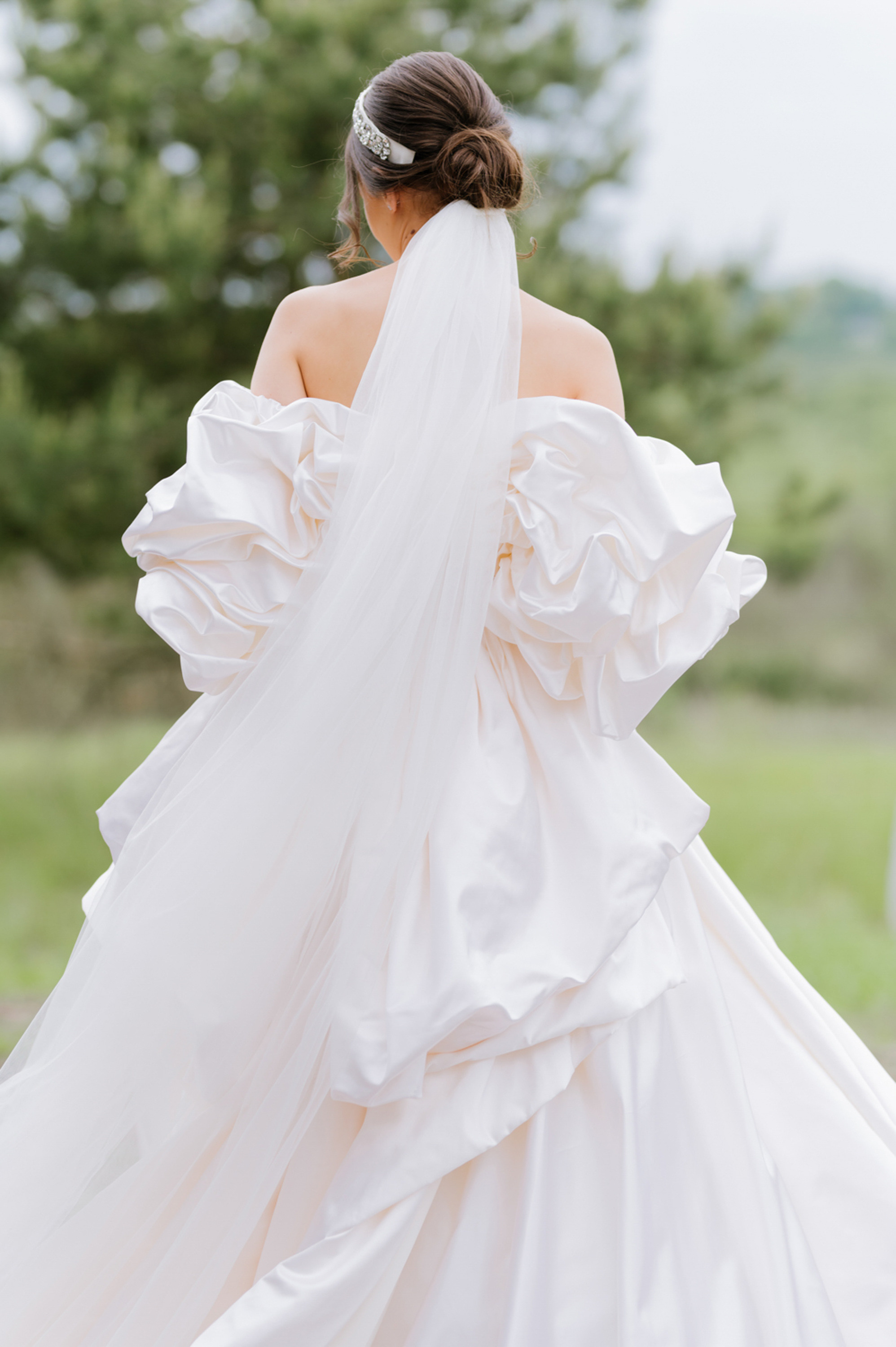 a bride in a white wedding dress with a veil