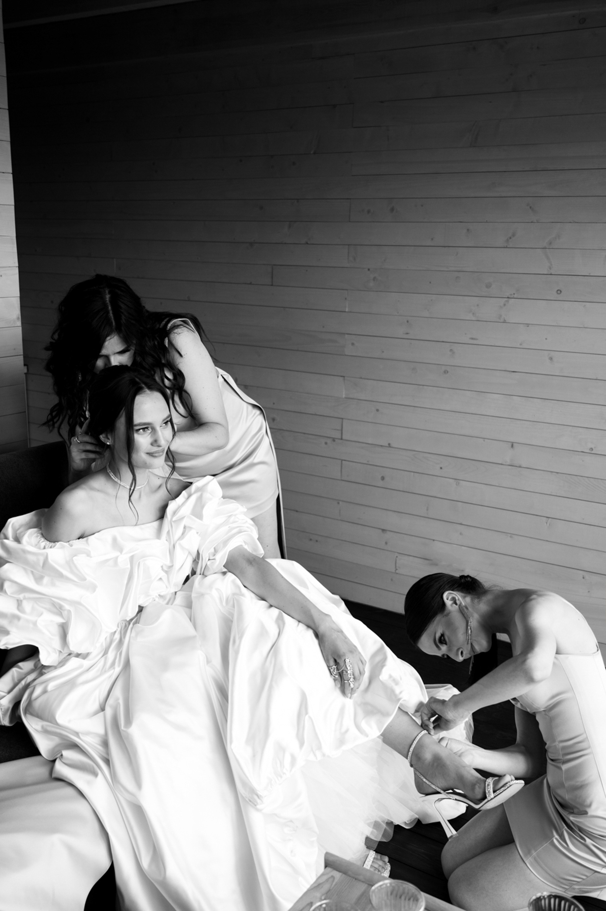a bride and her bridesmaids getting ready for their wedding