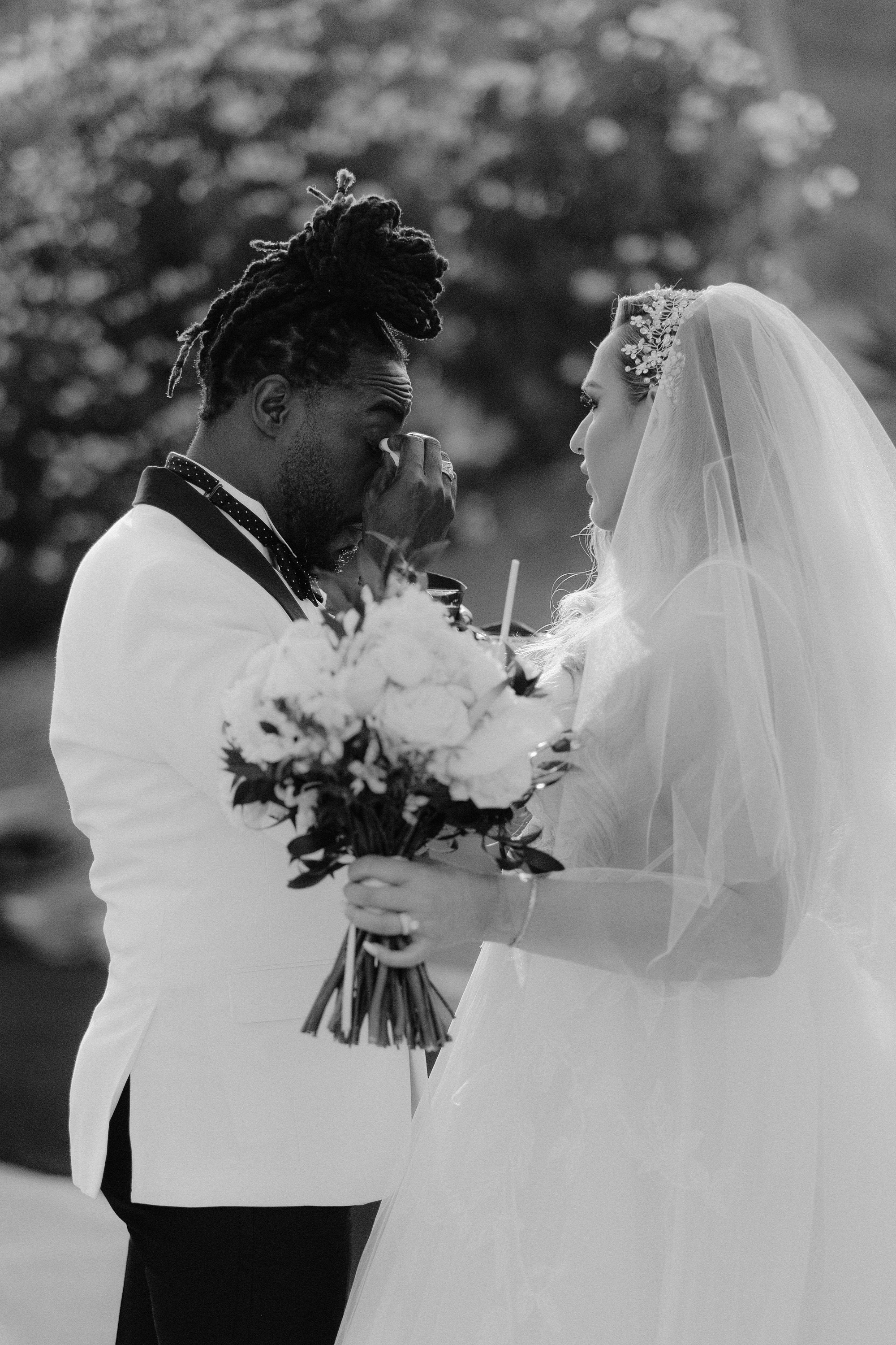 a bride and groom are standing together