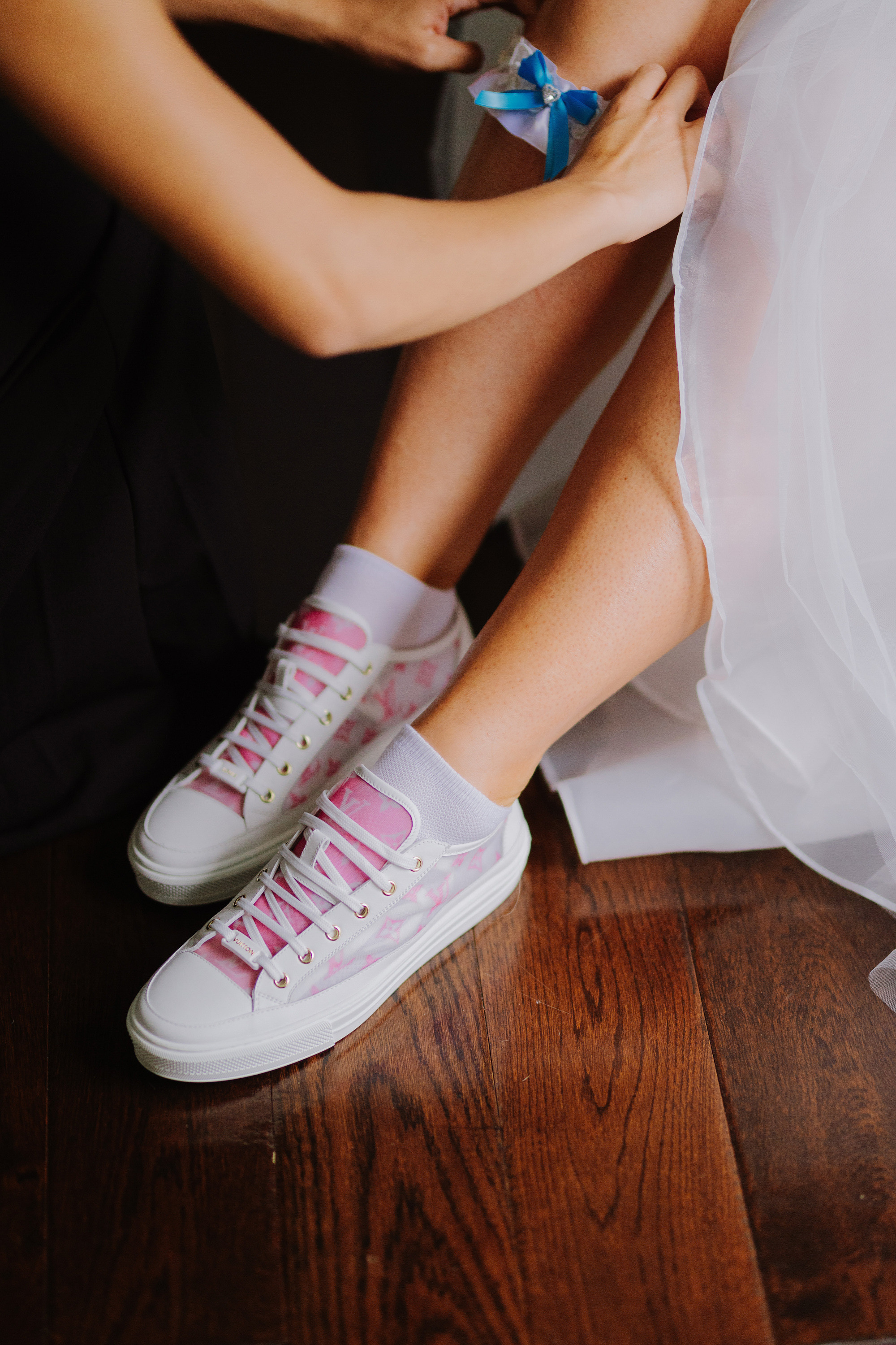 a bride putting on her shoes