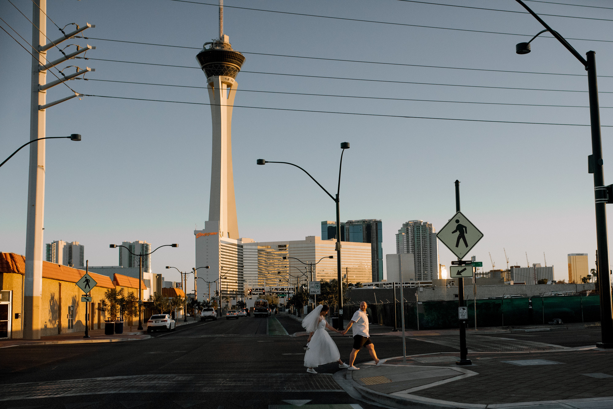 a woman walking down a street in a city
