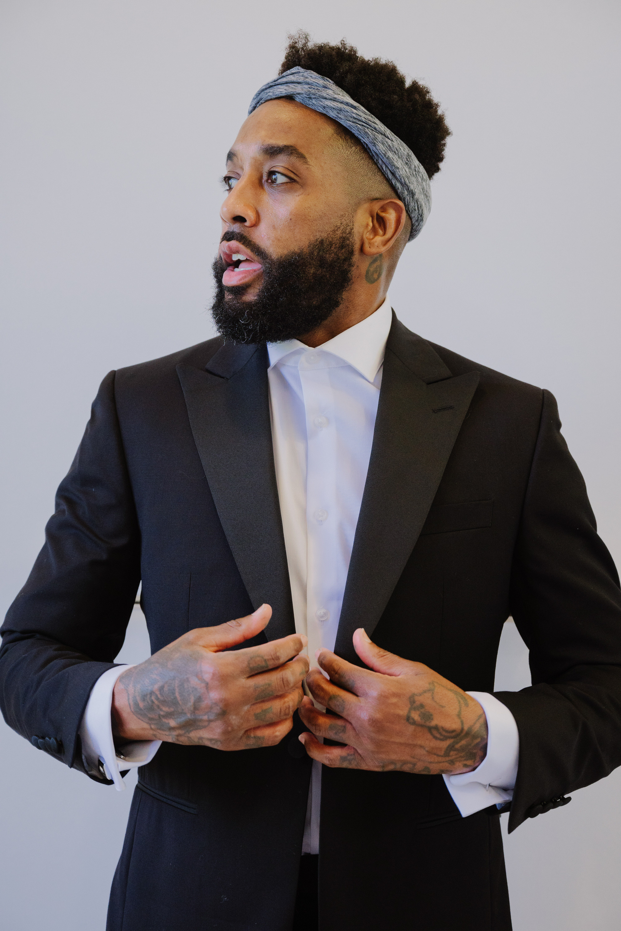 a man with a beard and a tuk