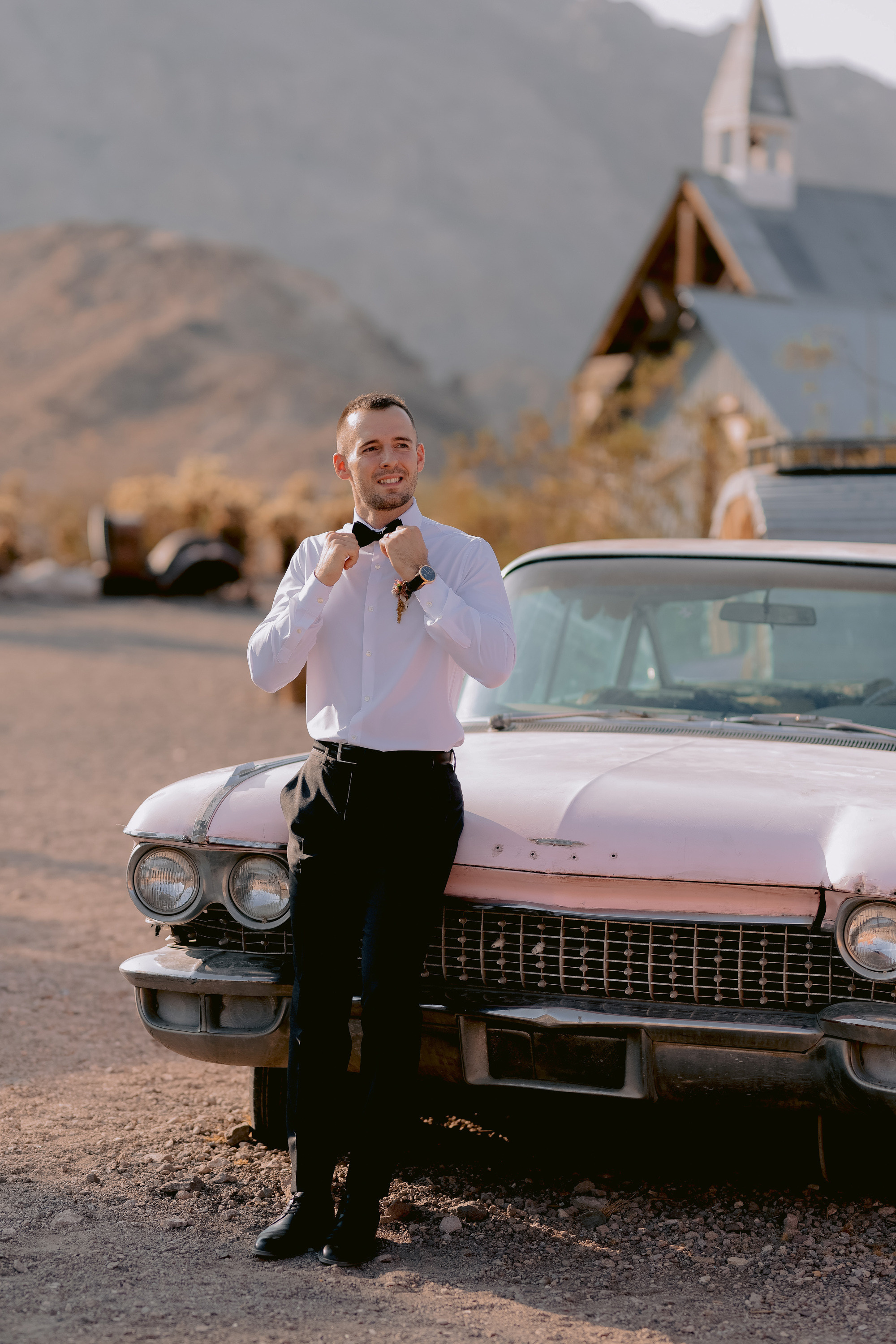 a man standing next to a car
