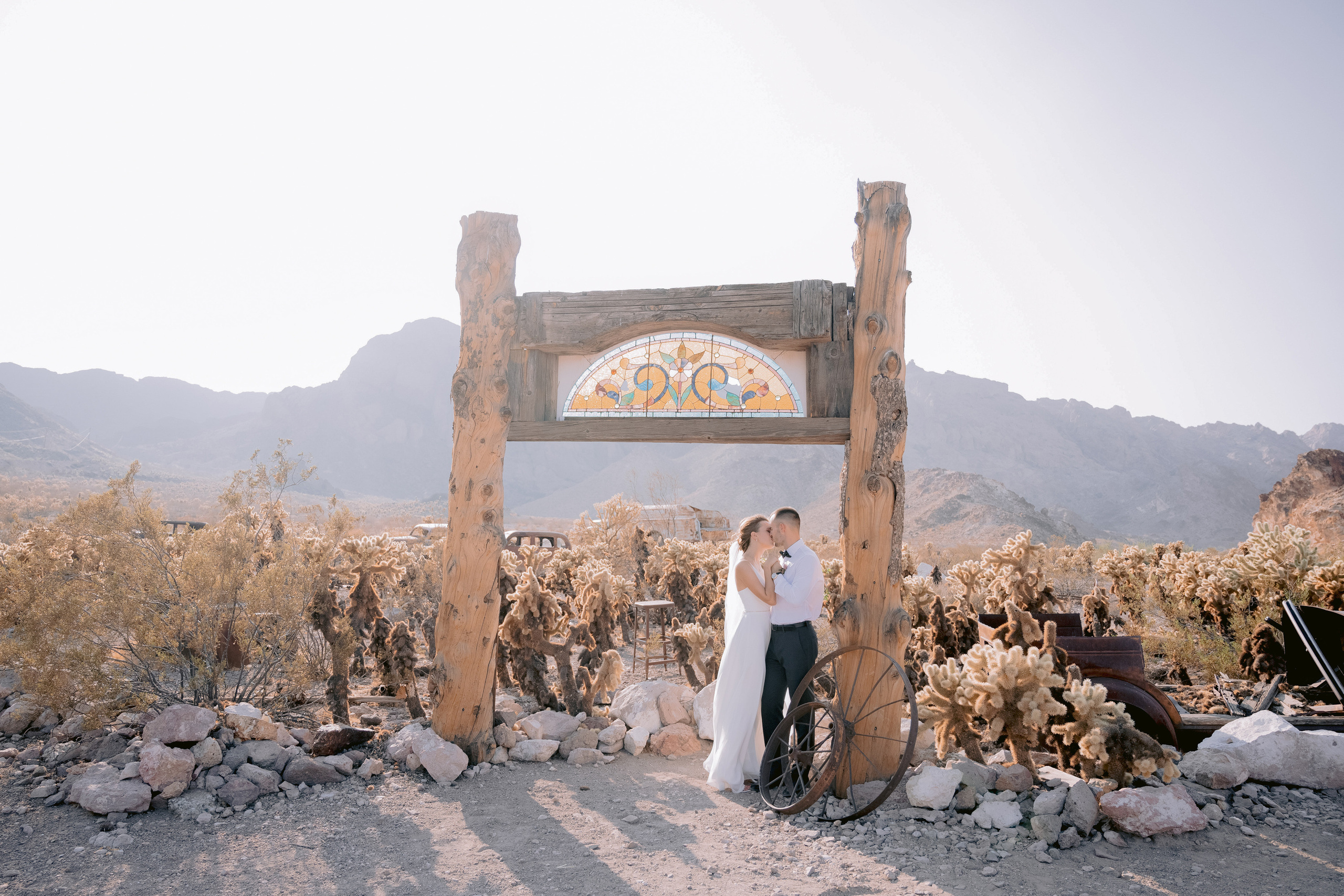 a couple standing in front of a sign