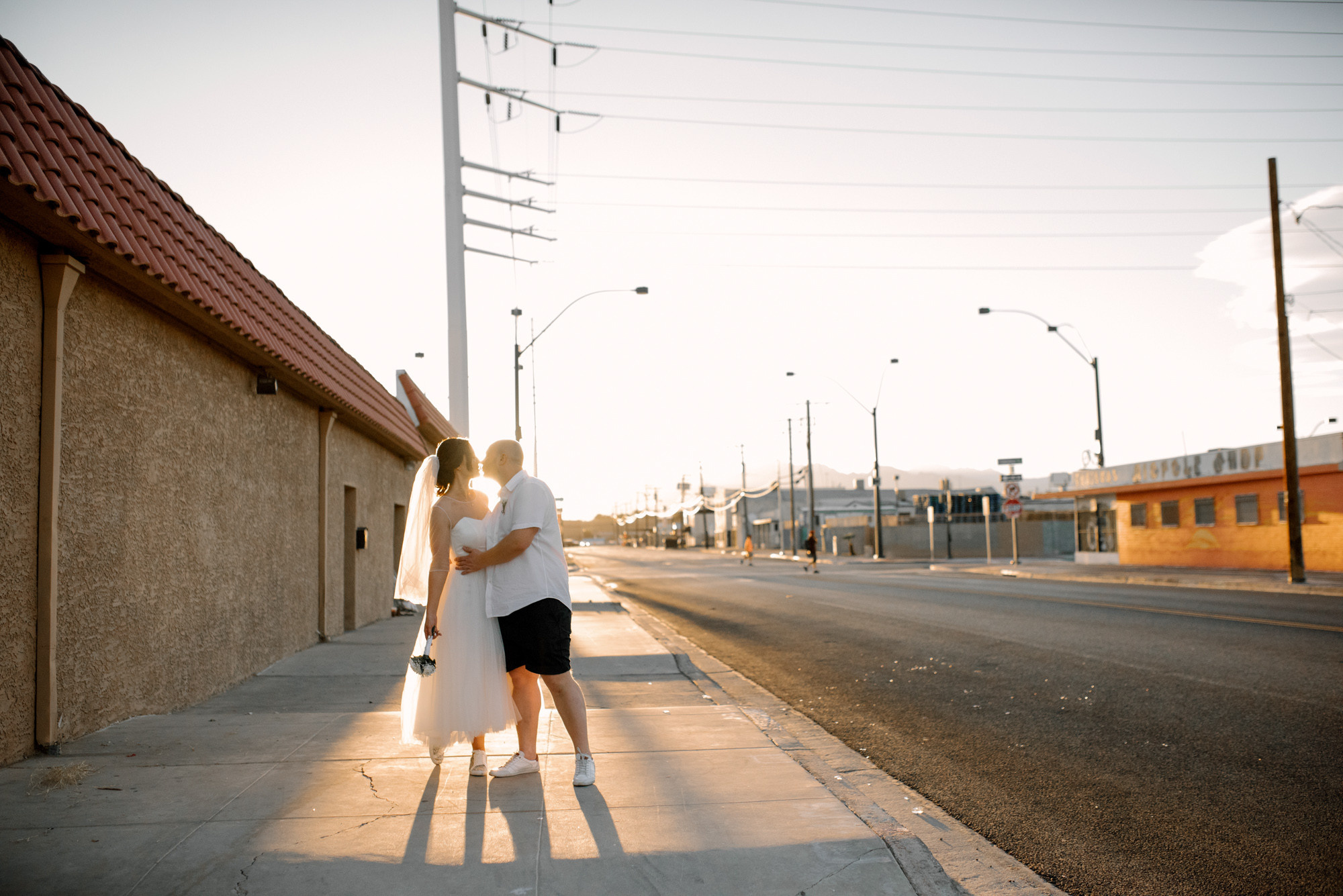 a woman standing on the sidewalk
