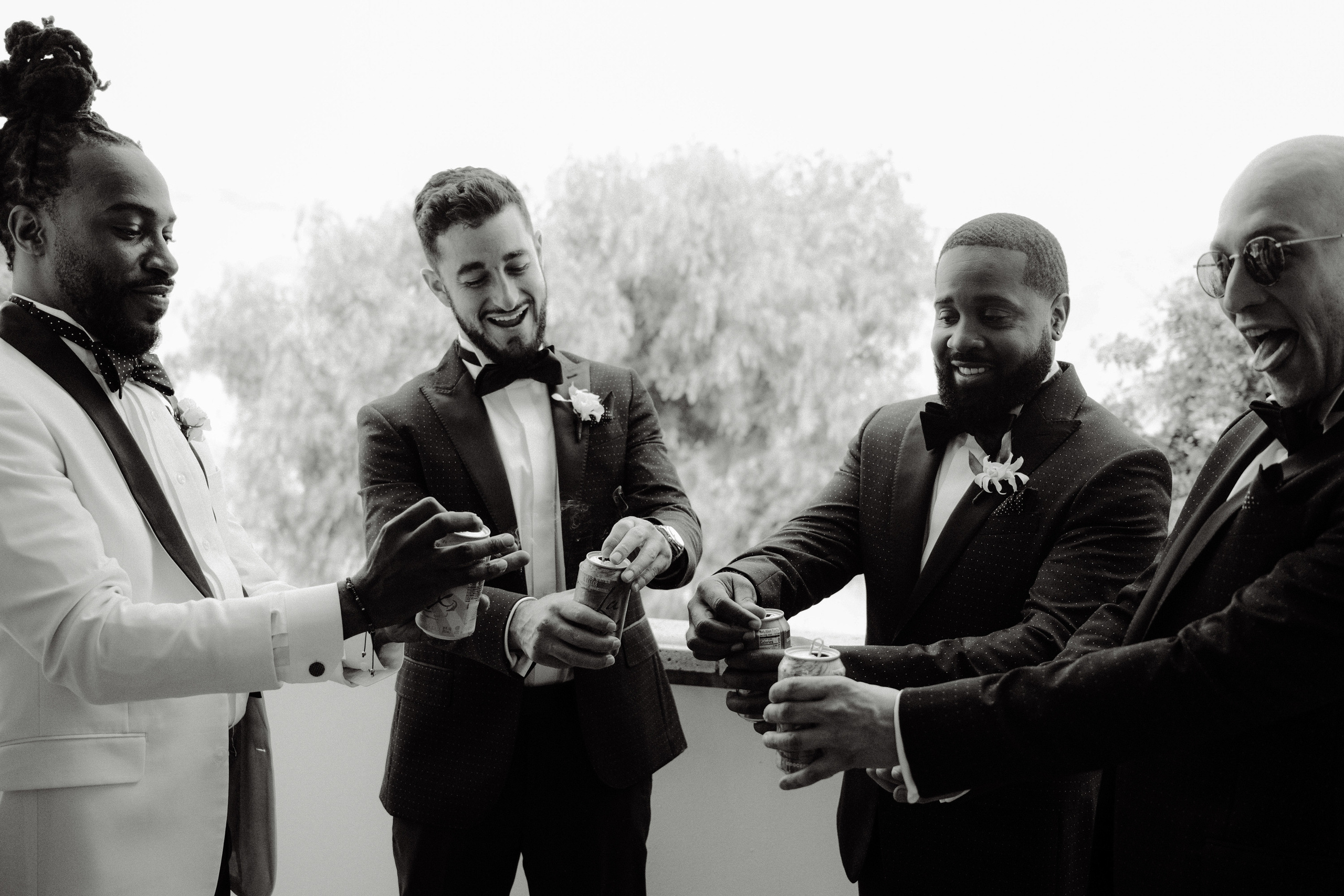 a group of men in suits and ties holding cell phones