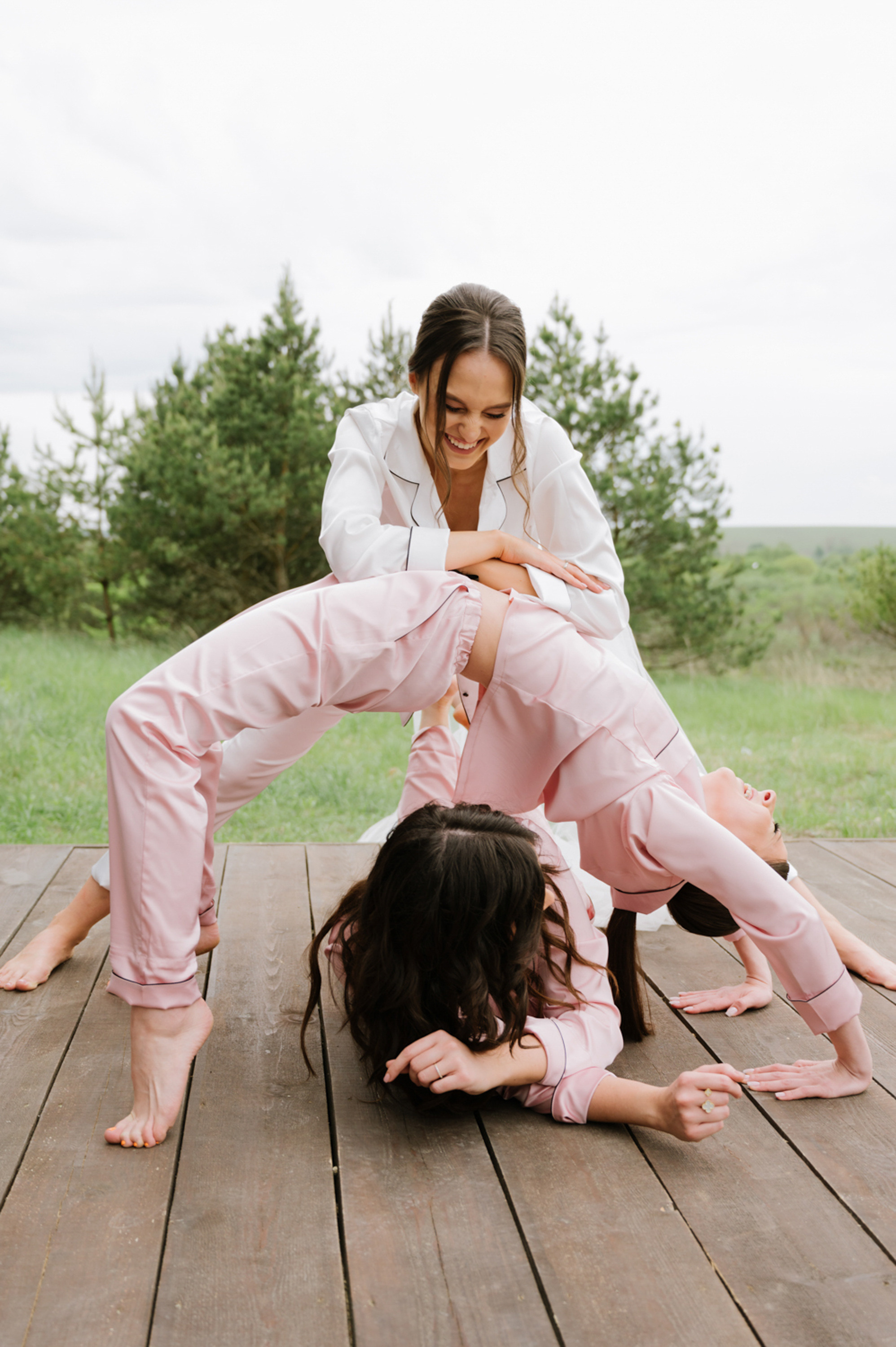 a woman in pink pants is doing a trick