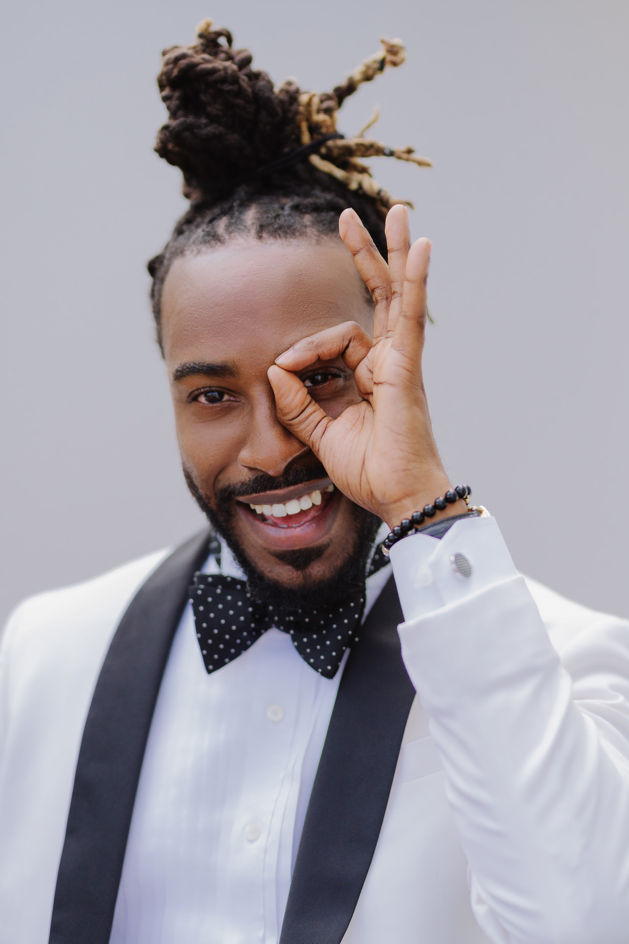 a man with a black tie and a white shirt