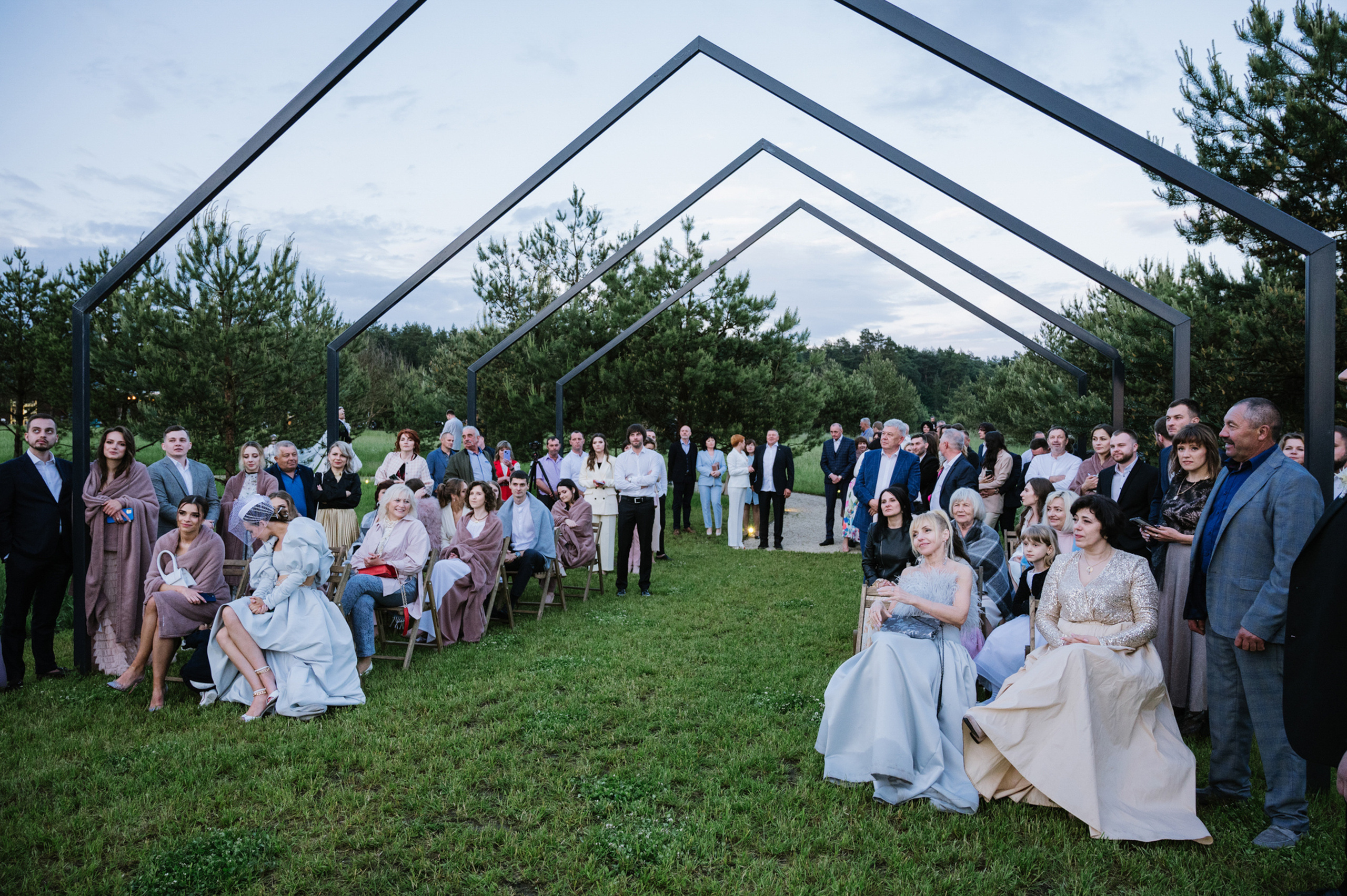 a group of people standing around a large group of people