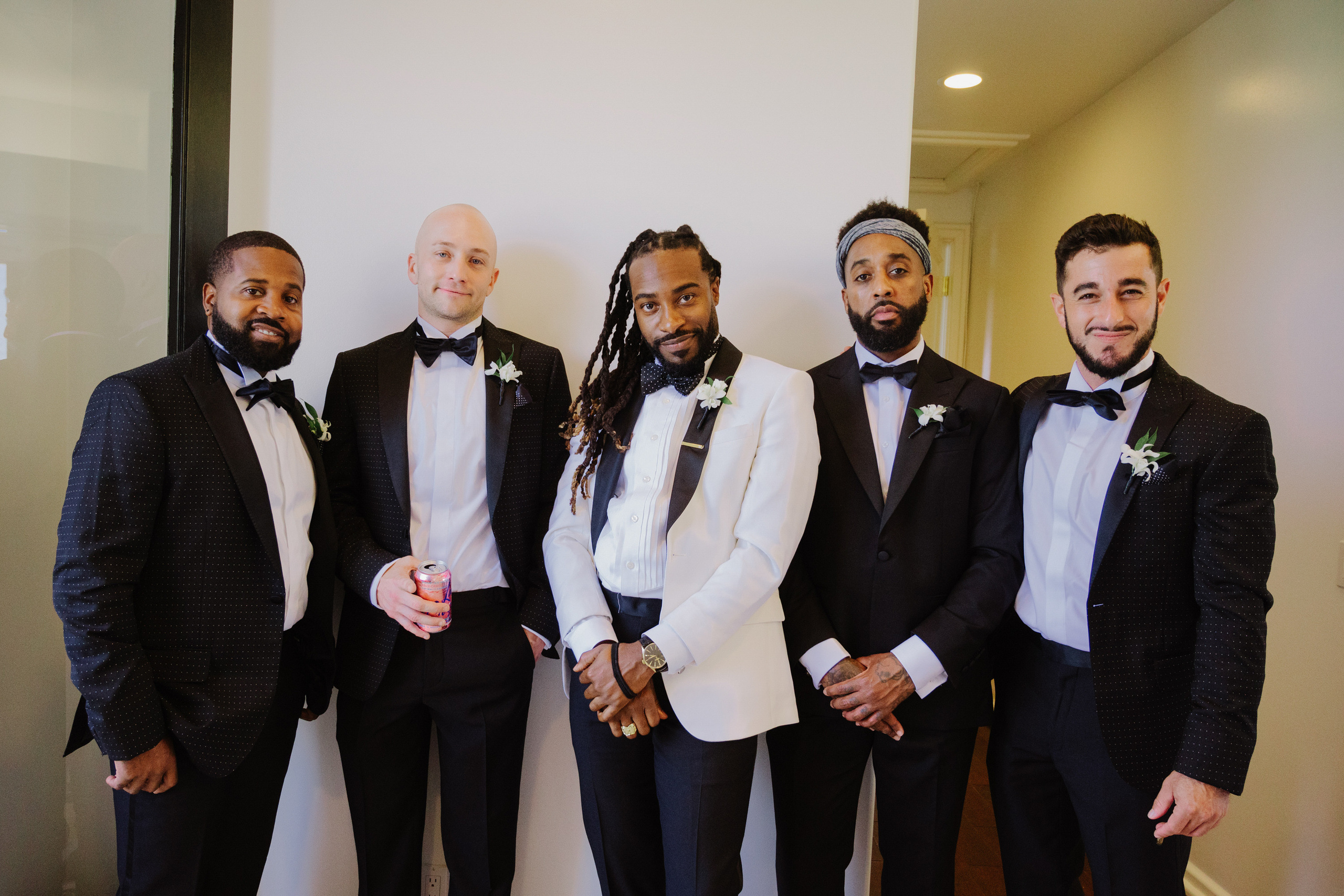 a group of men in suits and ties posing for a picture