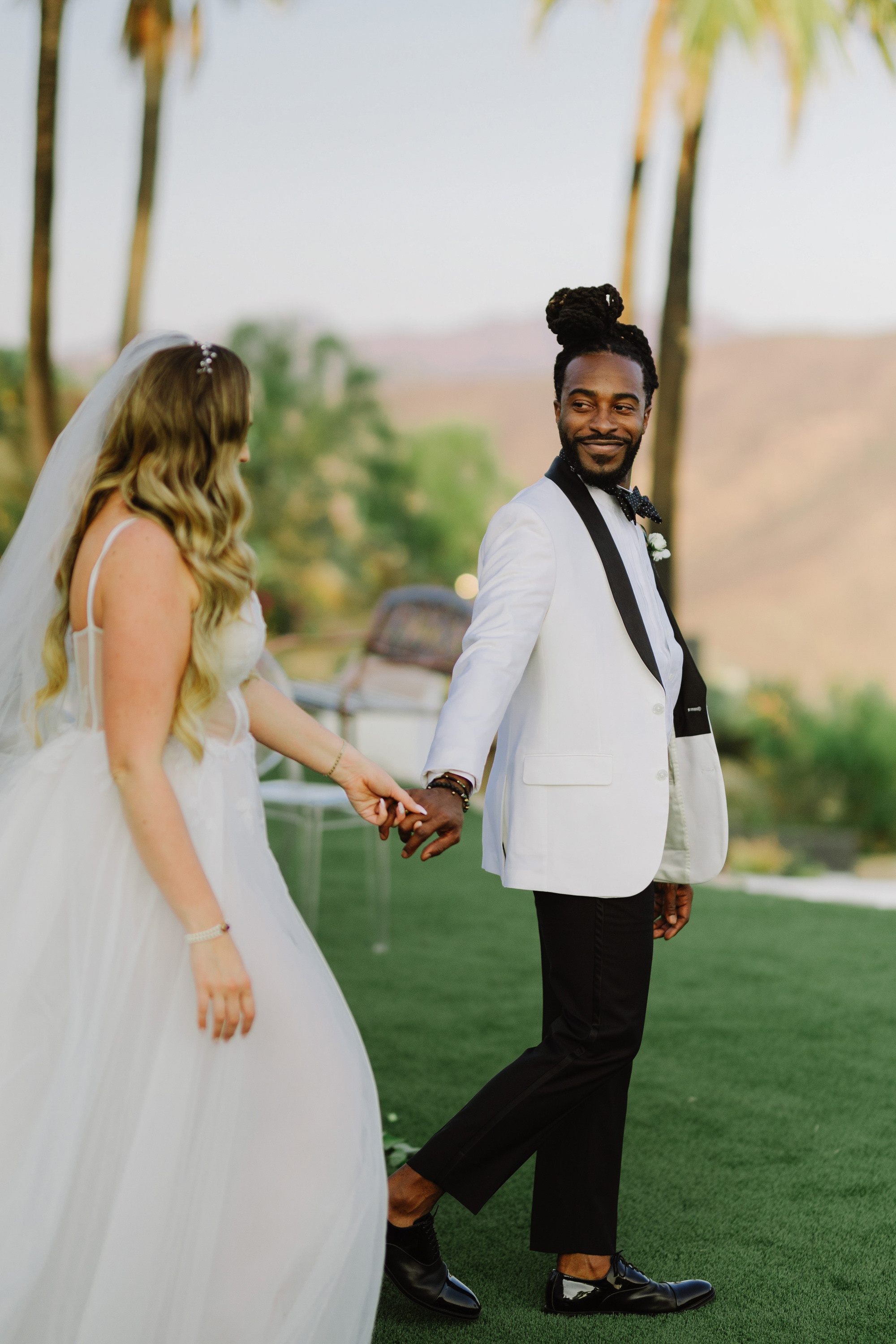 a bride and groom walking together