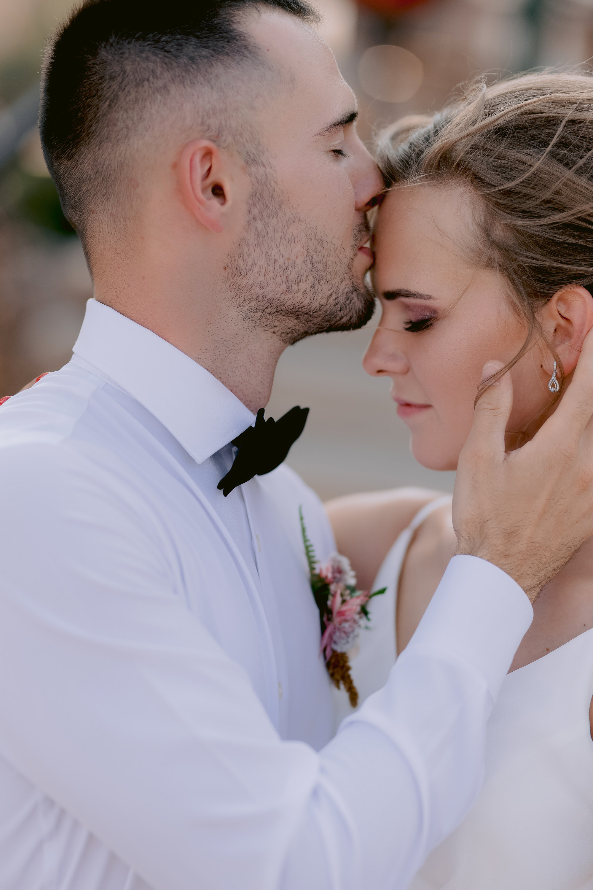 a bride and groom kissing